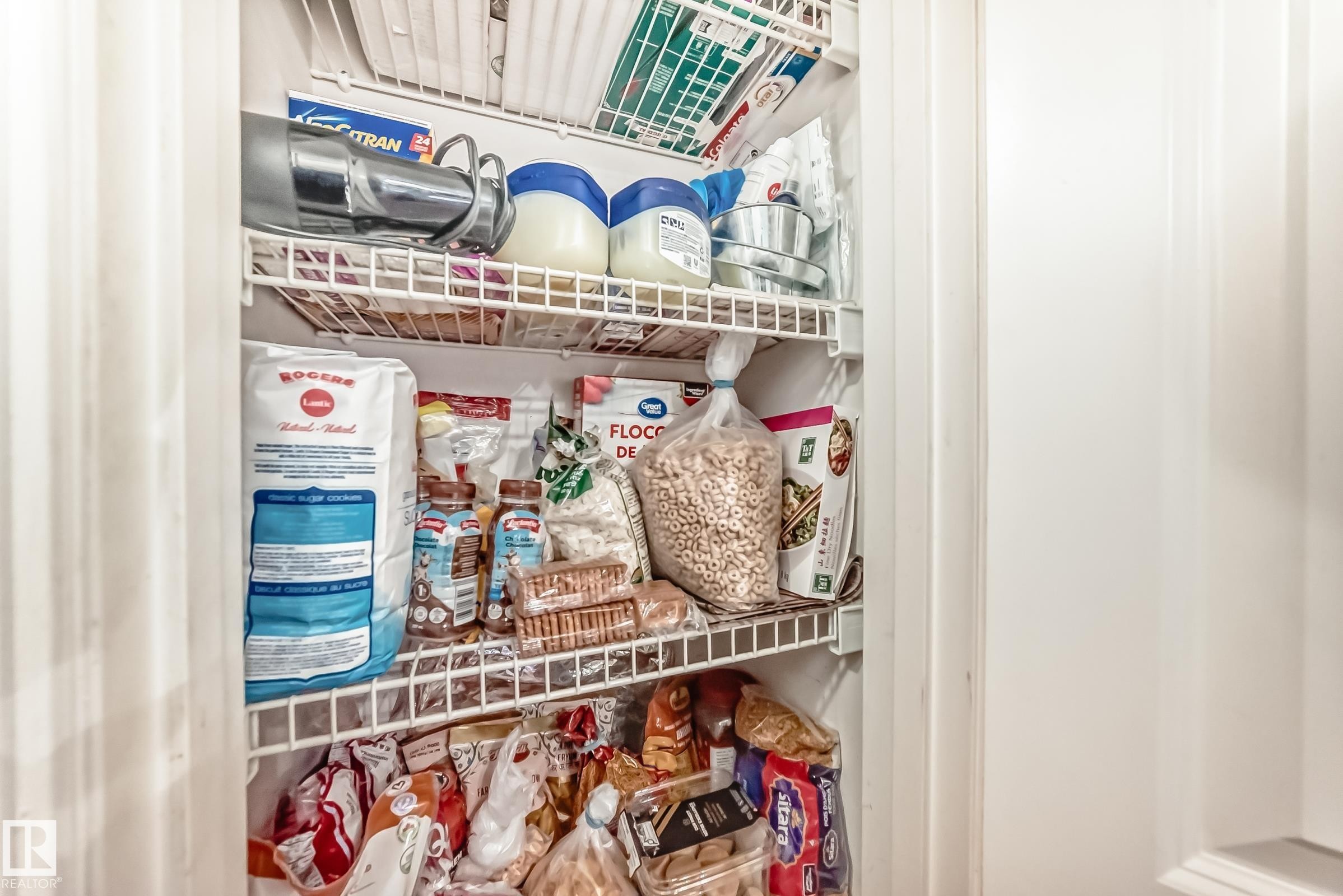 Pantry with white wire shelving - 108 10535 122 Street, Edmonton, AB