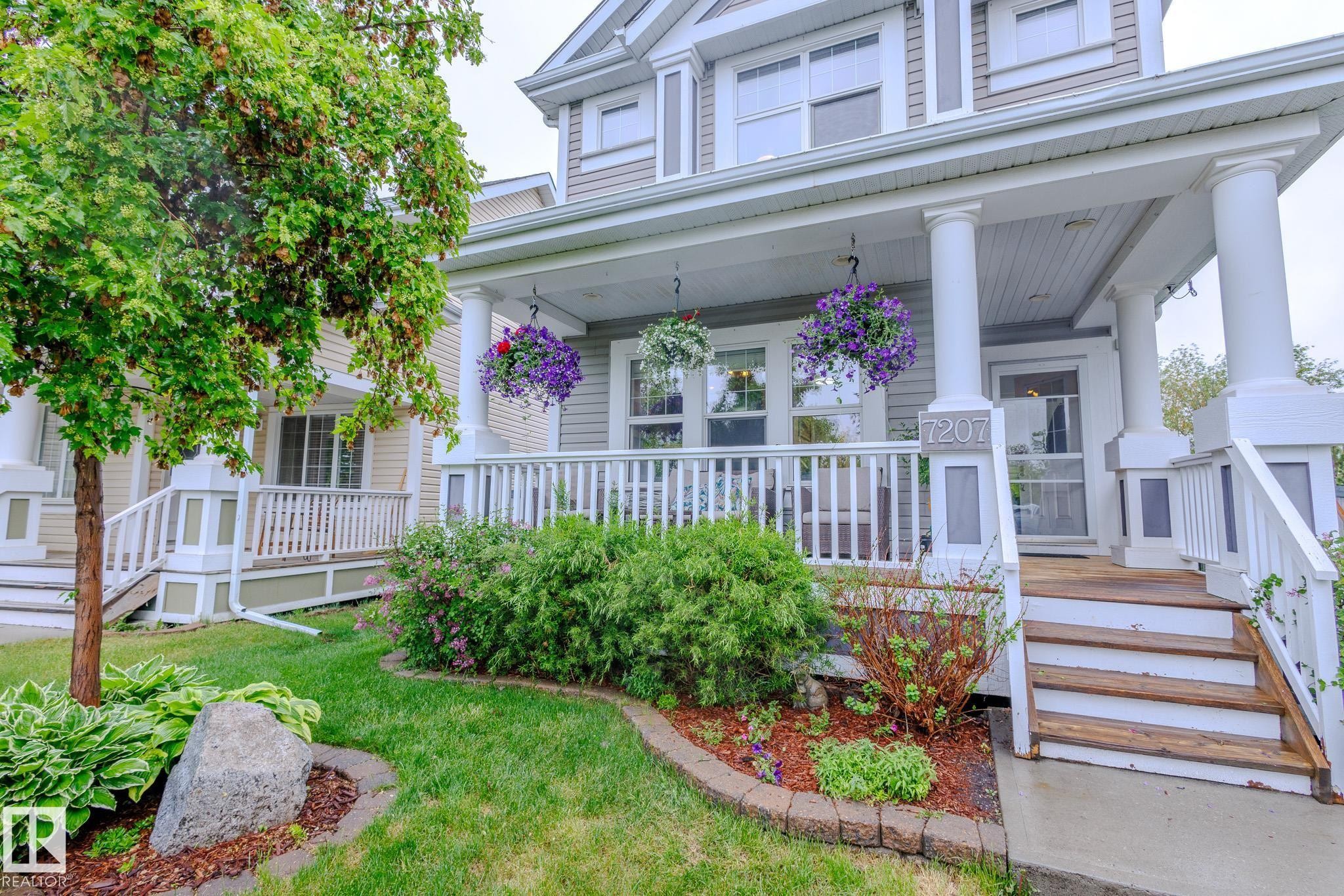 Classic front porch featuring white columns and railing - 7207 14A Avenue, Edmonton, AB - Outdoor With Deck Patio Veranda