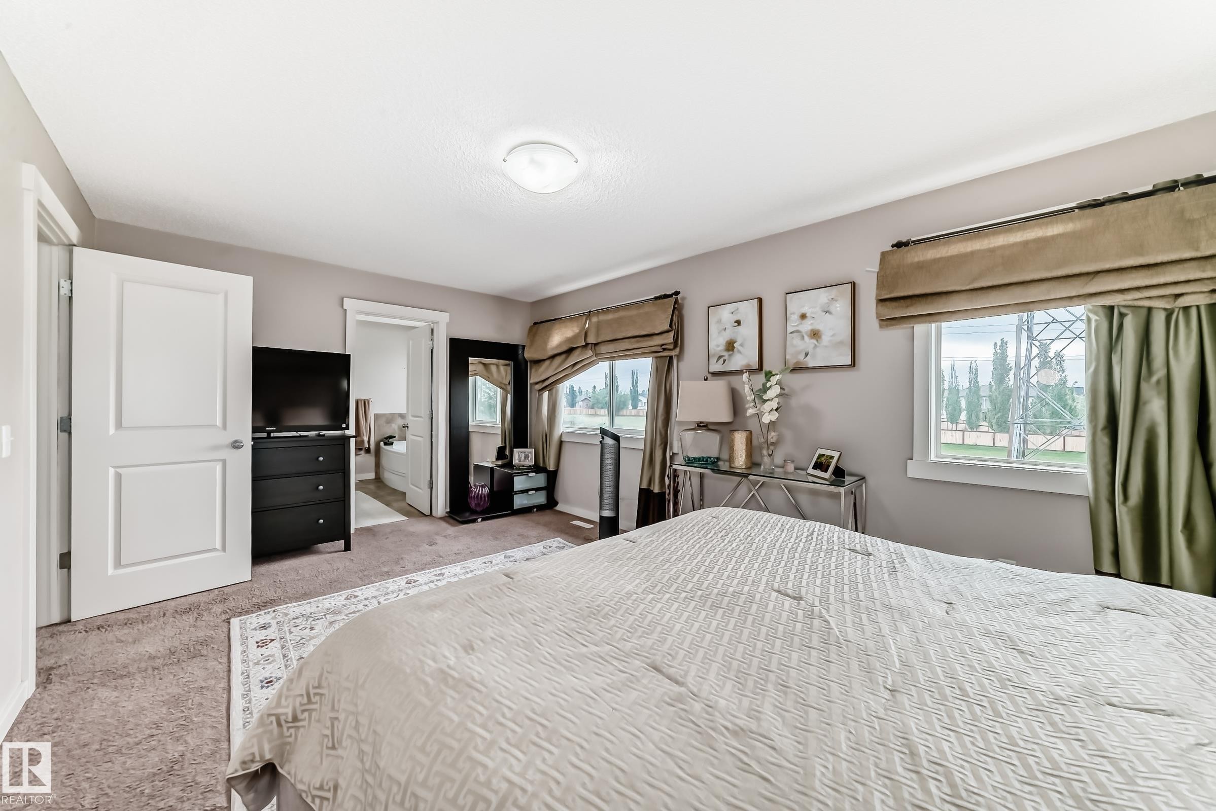 Carpeted bedroom featuring a neutral color palette and recessed lighting - 2808 36 Avenue, Edmonton, AB