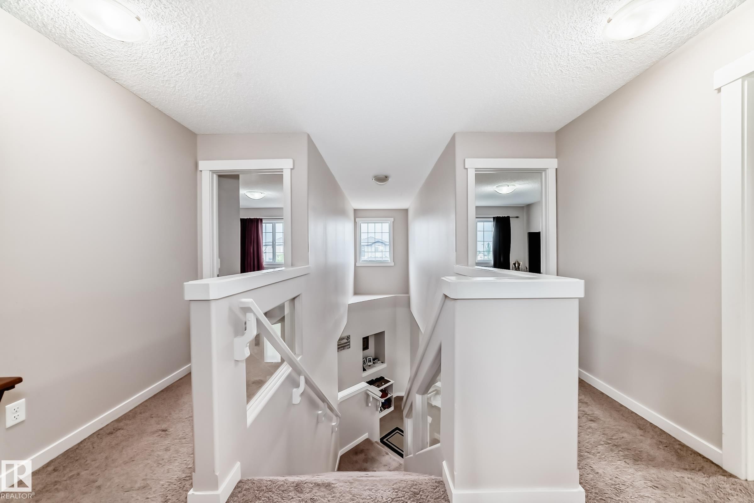 Upper-level hallway with neutral wall paint and carpeting - 2808 36 Avenue, Edmonton, AB