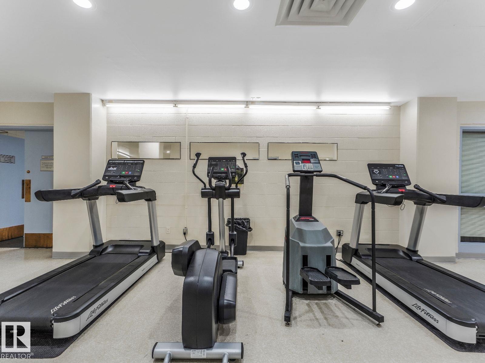 Dedicated fitness area featuring multiple cardio machines - 806 10149 Saskatchewan Drive, Edmonton, AB
