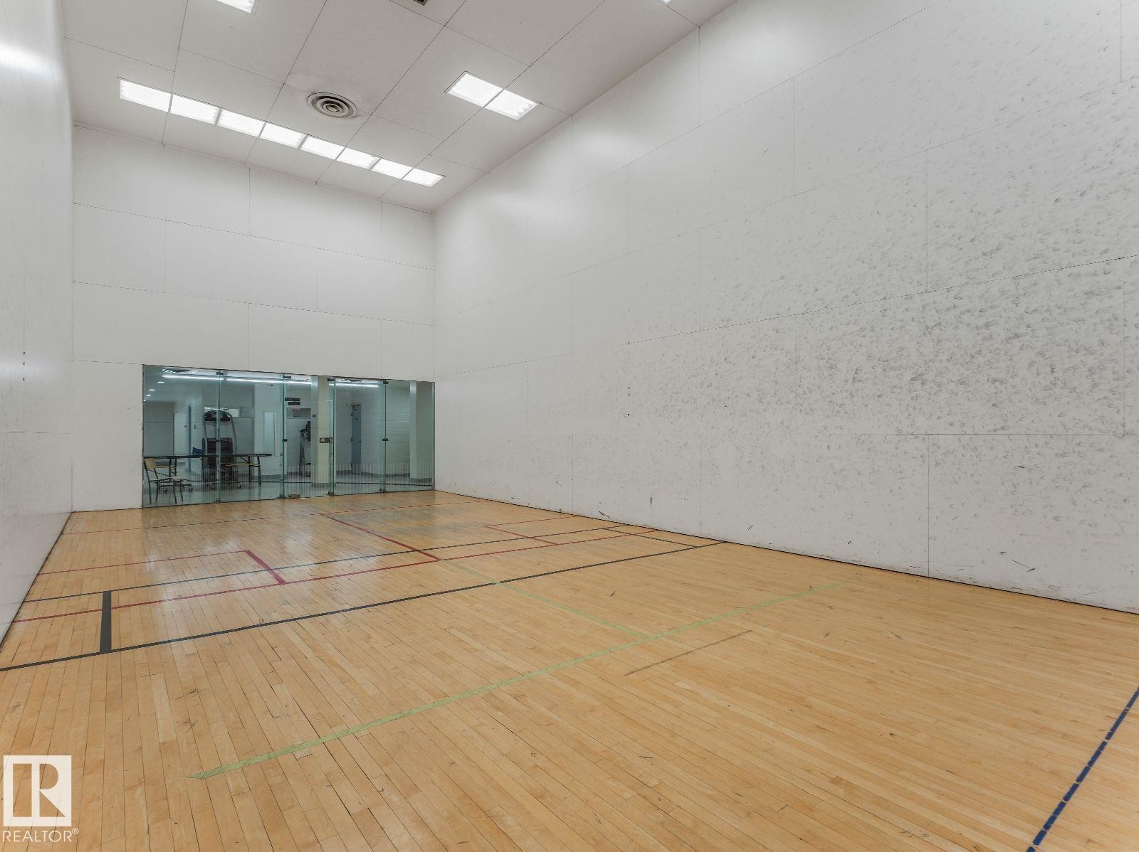 Indoor court featuring wood-finish flooring with court markings - 806 10149 Saskatchewan Drive, Edmonton, AB
