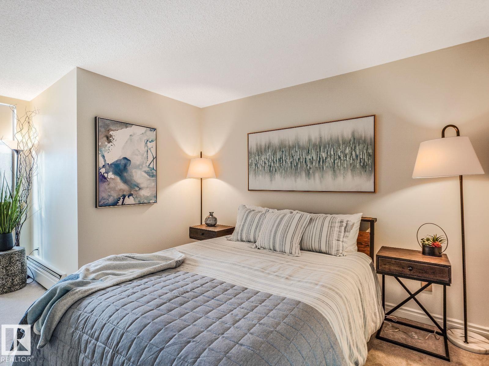 Neutral-toned walls and plush carpet flooring define this interior space - 806 10149 Saskatchewan Drive, Edmonton, AB