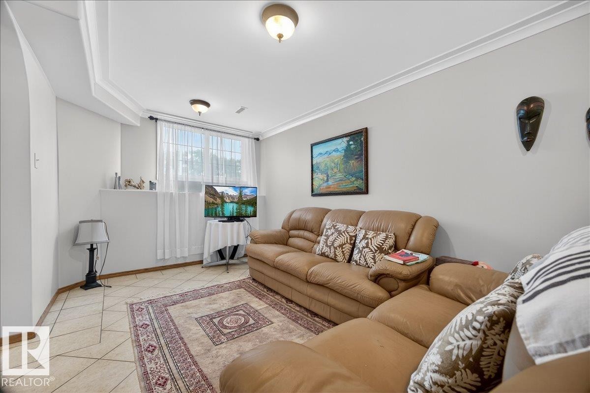 Interior room featuring light-toned walls and crown molding - 5108 138A Avenue, Edmonton, AB