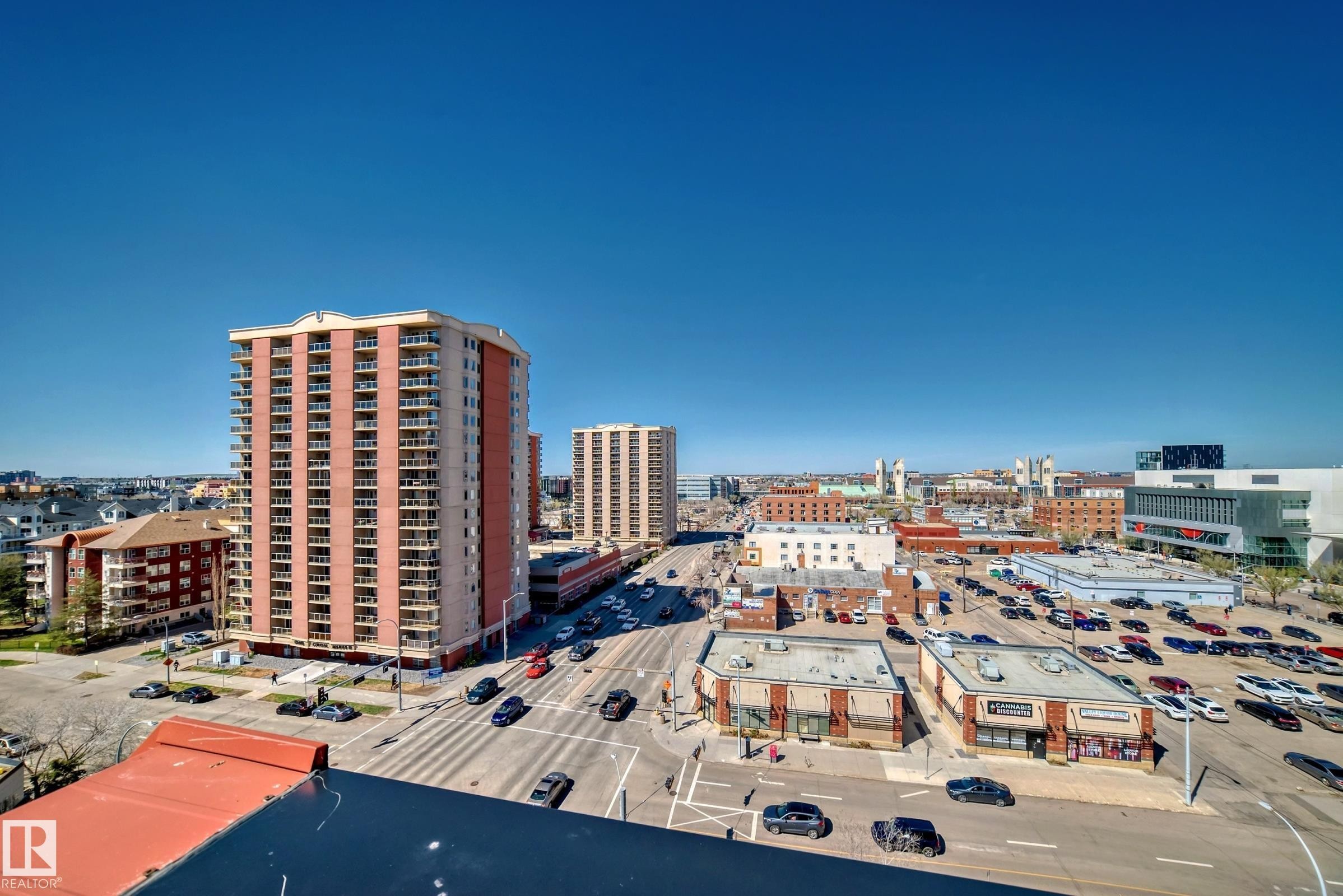 High-rise residential building featuring multiple balconies and a brick facade - #706 10125 109 St Nw, Edmonton, AB