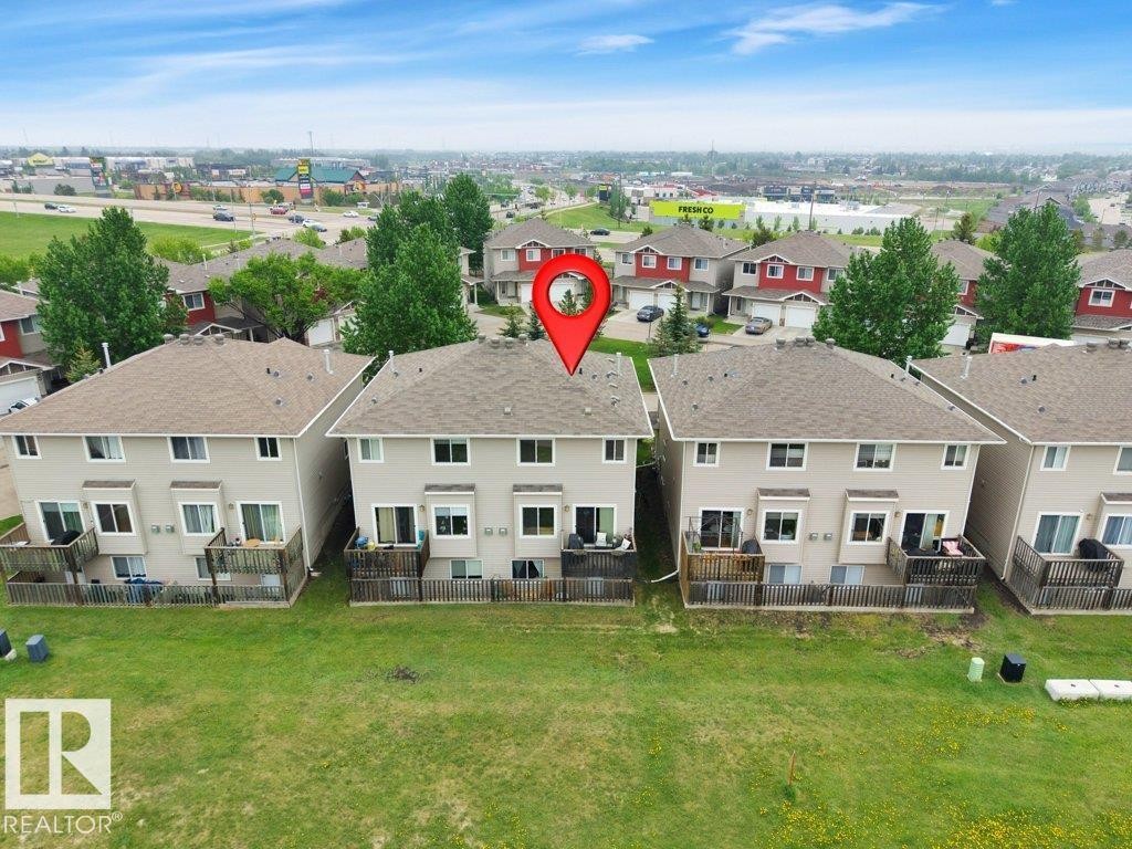 Back of structure - 10 15151 43 Street, Edmonton, AB - Outdoor With Deck Patio Veranda