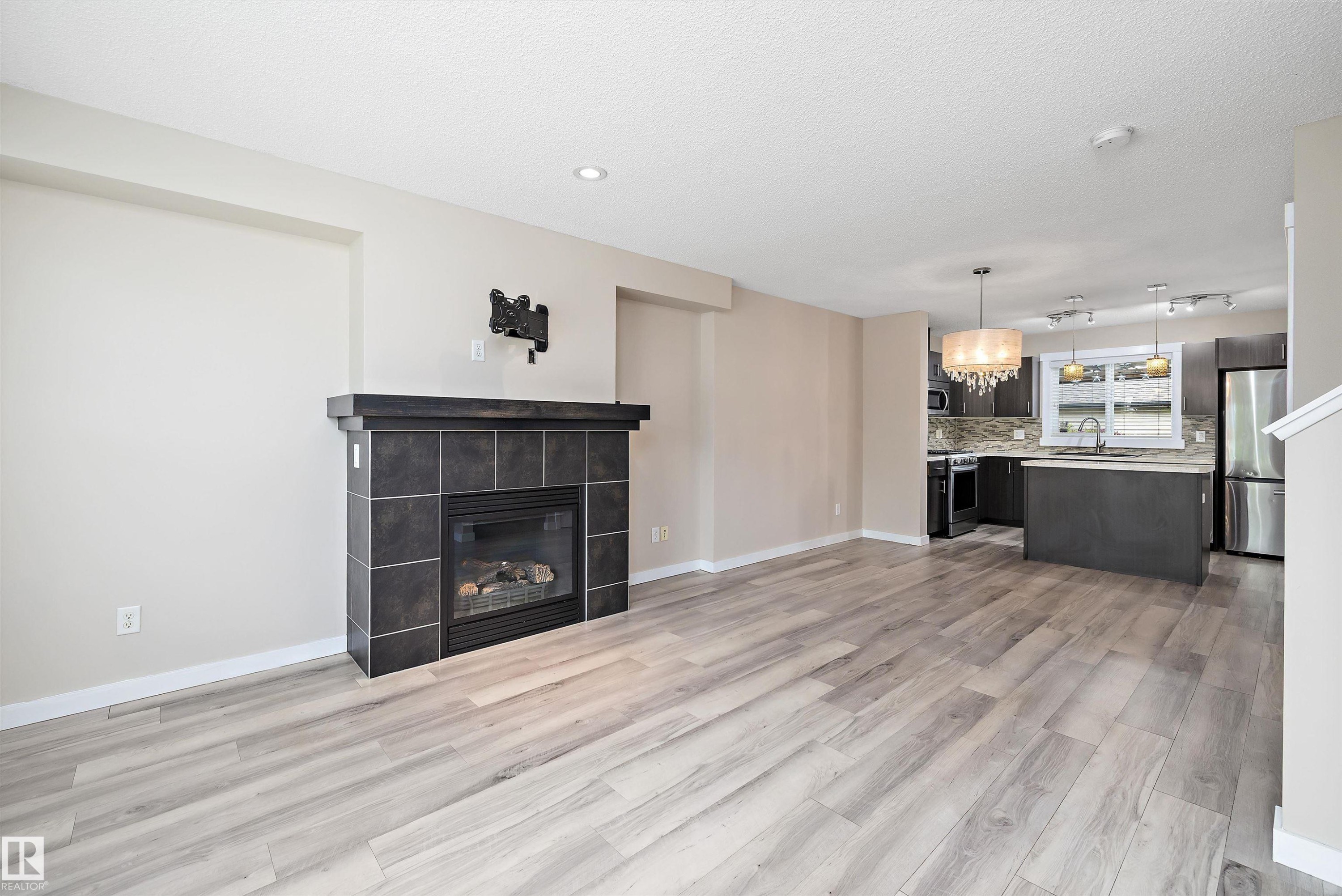 2914 18A Avenue, Edmonton, AB - Indoor Photo Showing Living Room With Fireplace