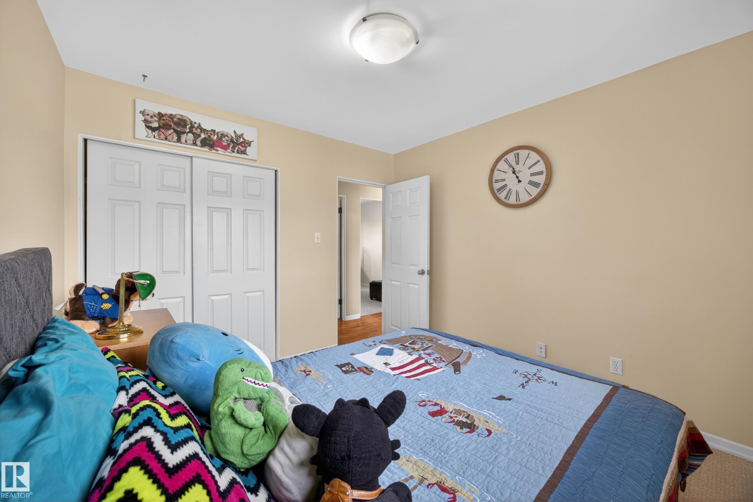 Bedroom featuring neutral-toned walls, white trim, and carpet flooring - 5216 104A Street, Edmonton, AB - Indoor Photo Showing Bedroom