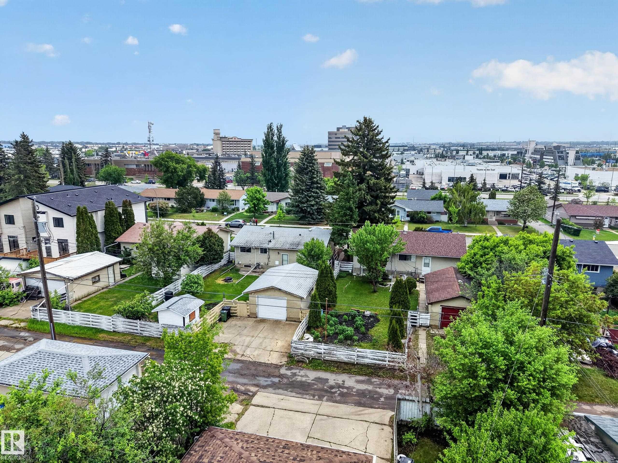 Aerial perspective highlighting the property with a detached garage and mature landscaping - 5216 104A Street, Edmonton, AB - Outdoor
