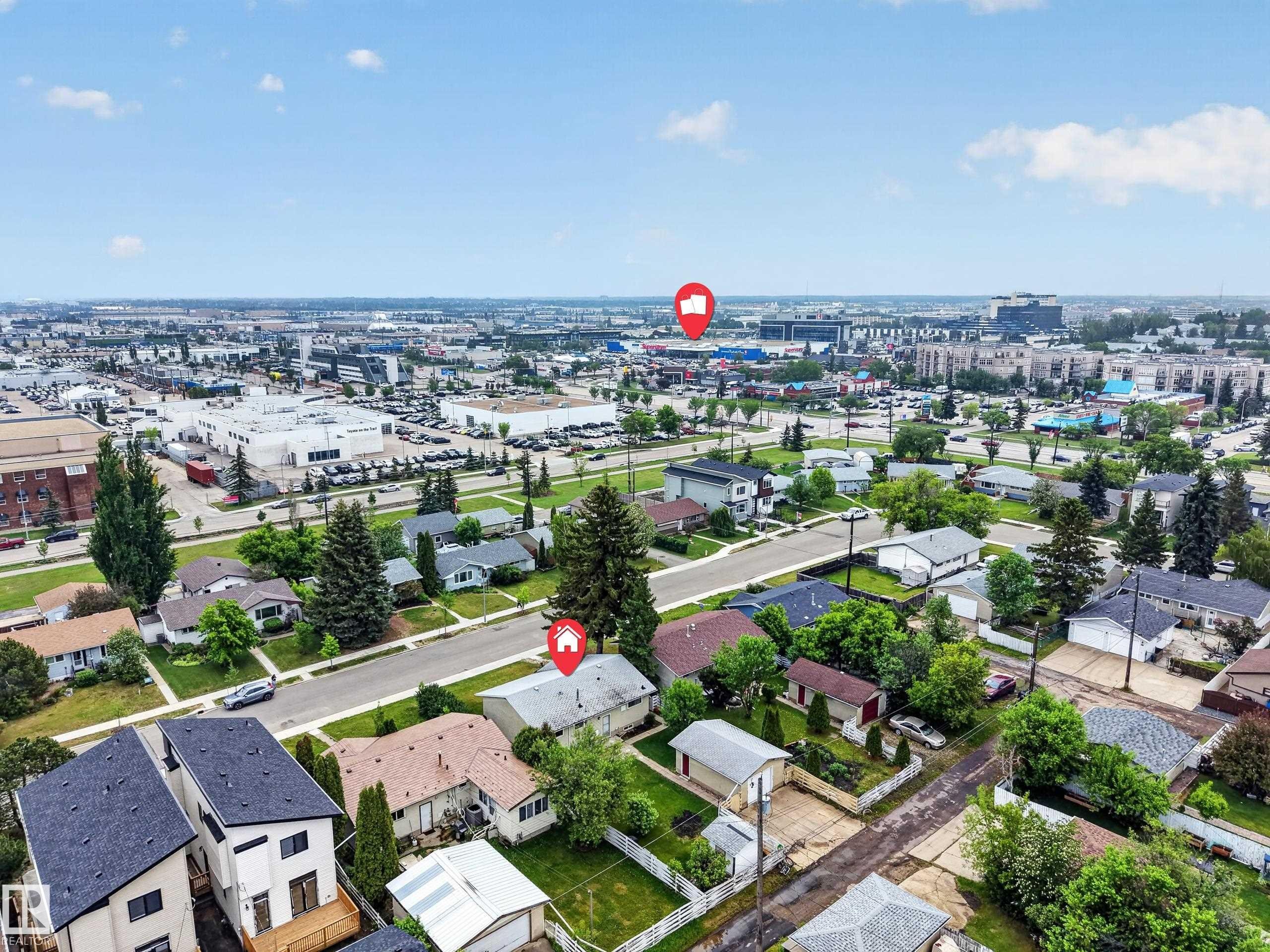 Aerial perspective showcasing a residential neighborhood with surrounding commercial districts - 5216 104A Street, Edmonton, AB - Outdoor With View