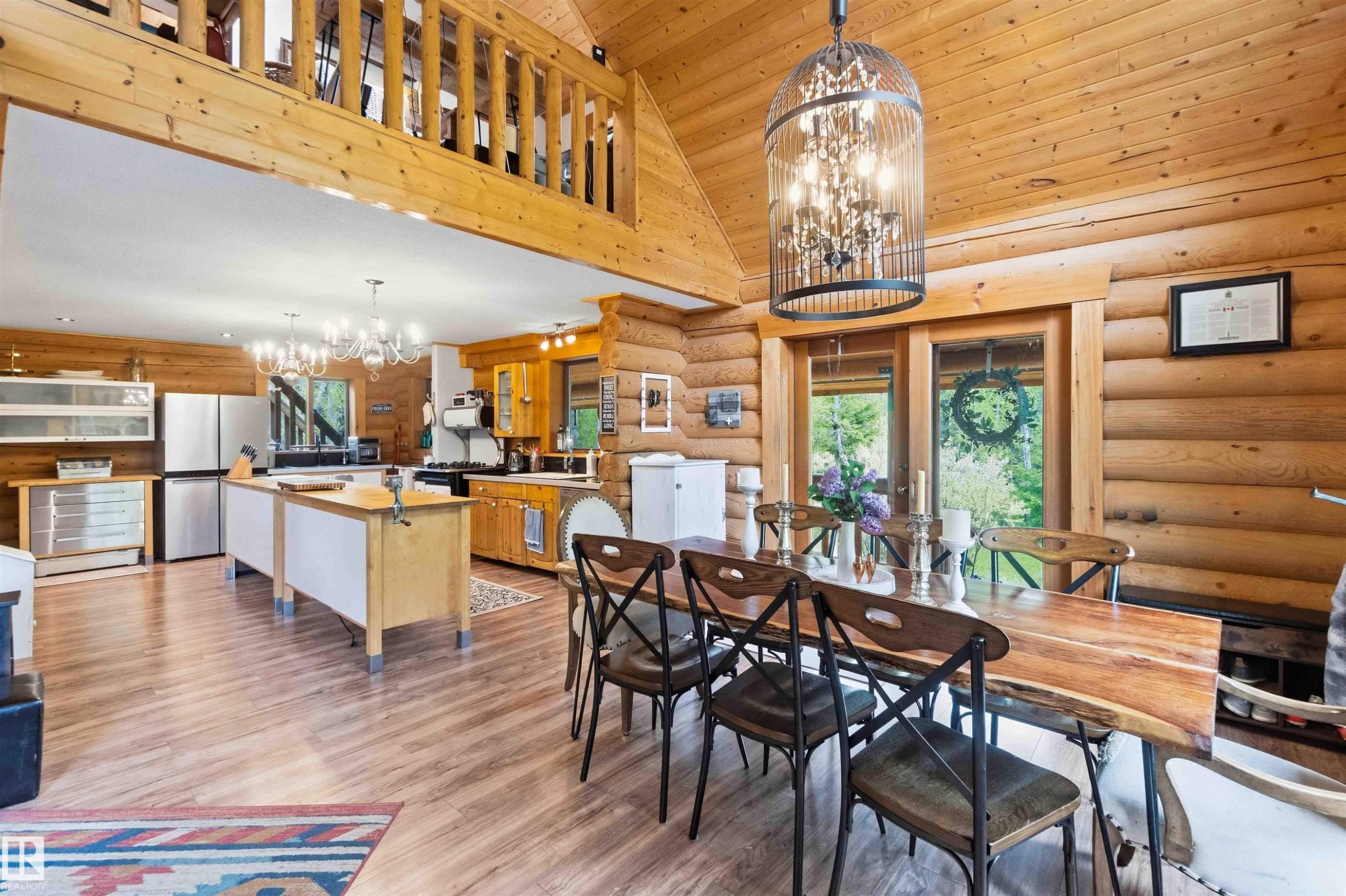 Vaulted wood-paneled ceiling with an open loft area - #17 A 15031 Twp Road 462, Rural Wetaskiwin County, AB - Outdoor With Deck Patio Veranda