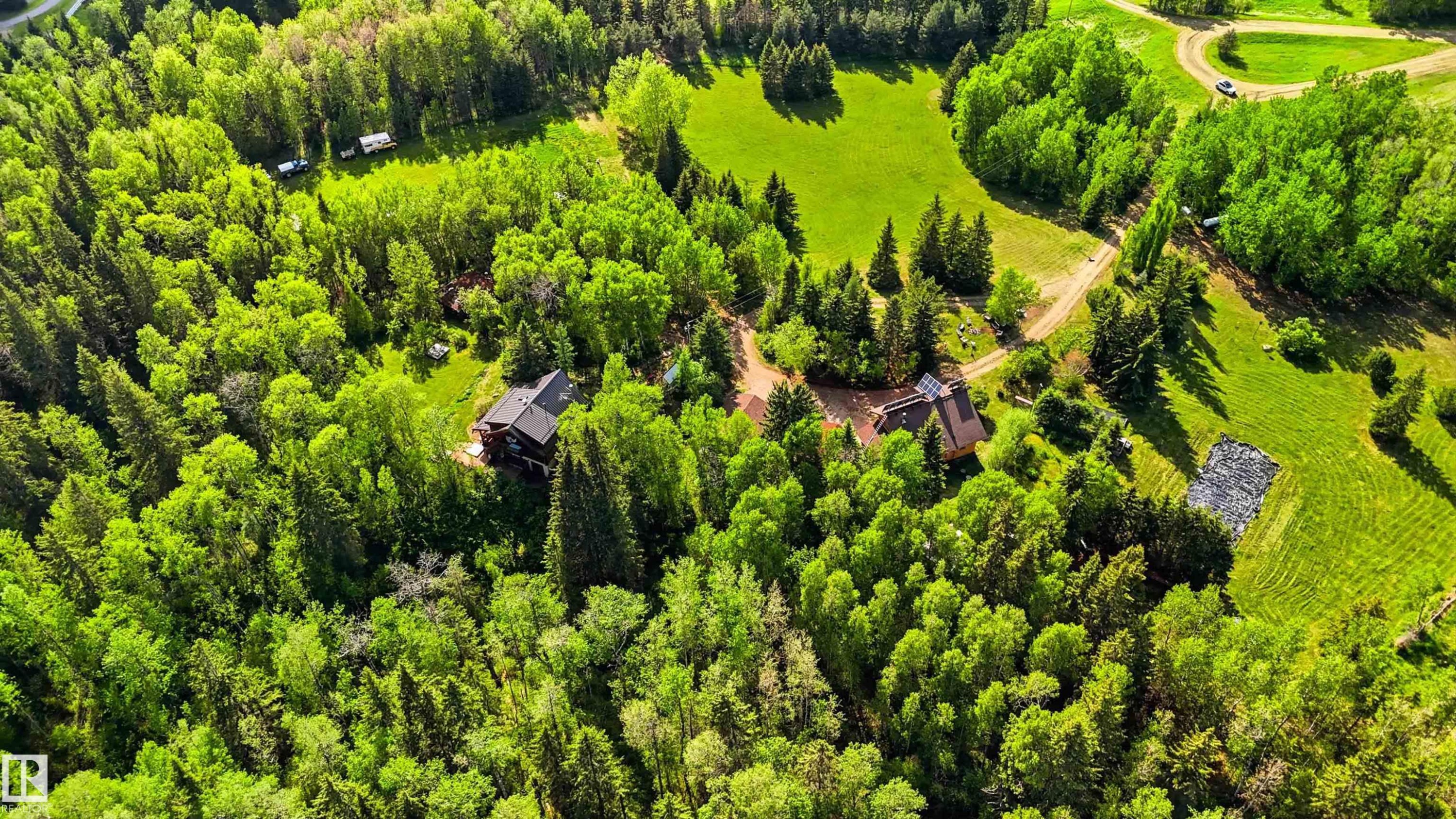 Expansive treed acreage featuring two distinct residential structures - #17 A 15031 Twp Road 462, Rural Wetaskiwin County, AB - Outdoor With View