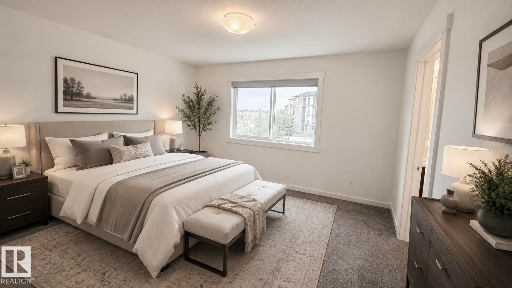 Spacious bedroom featuring neutral wall tones, window with white trim, recessed ceiling light, and carpet flooring - 3962 Claxton Loop, Edmonton, AB - Indoor Photo Showing Bedroom
