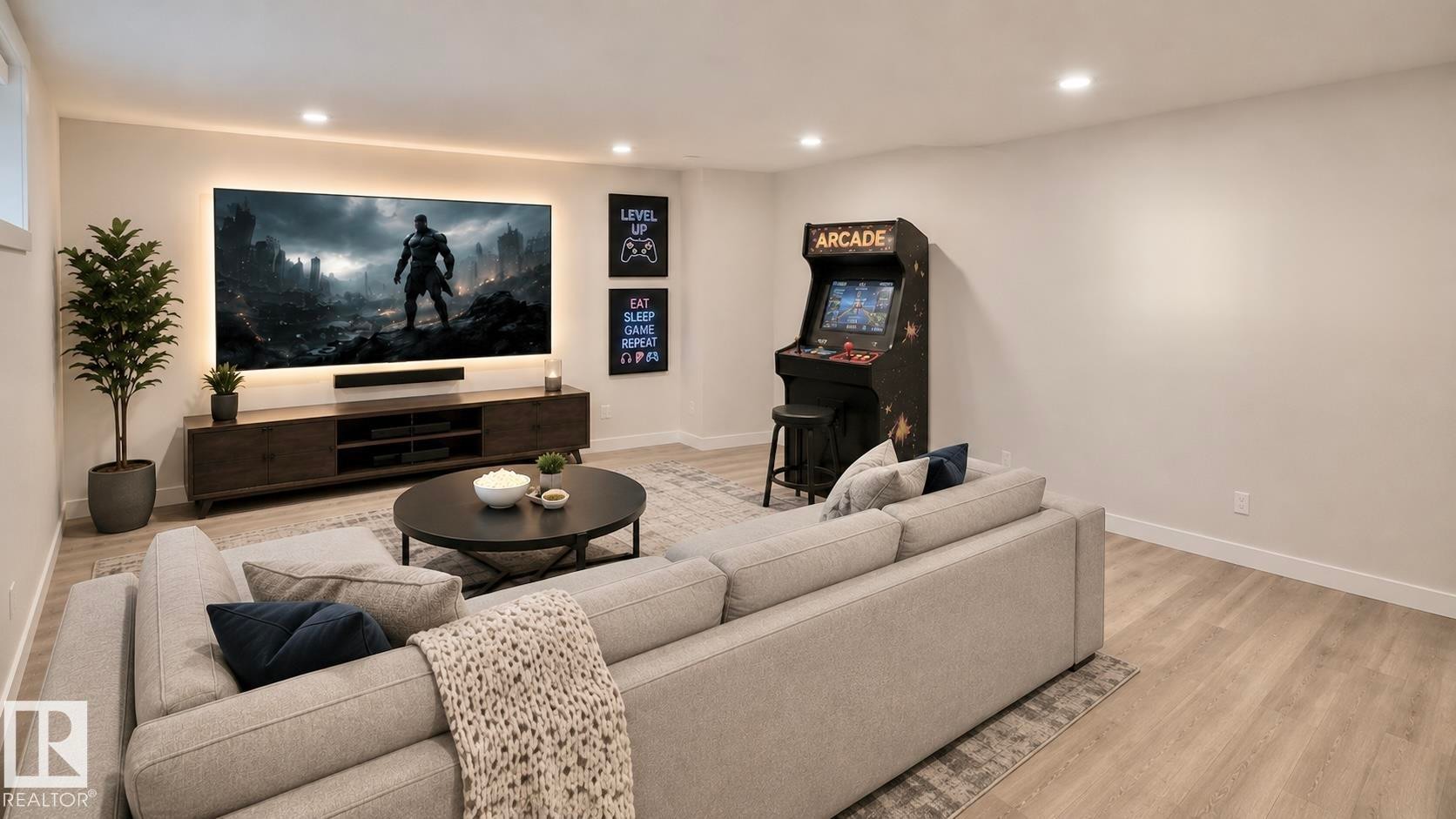 Finished recreational space featuring recessed lighting, light wood-finish flooring, and a media wall with backlighting - 3962 Claxton Loop, Edmonton, AB - Indoor Photo Showing Living Room