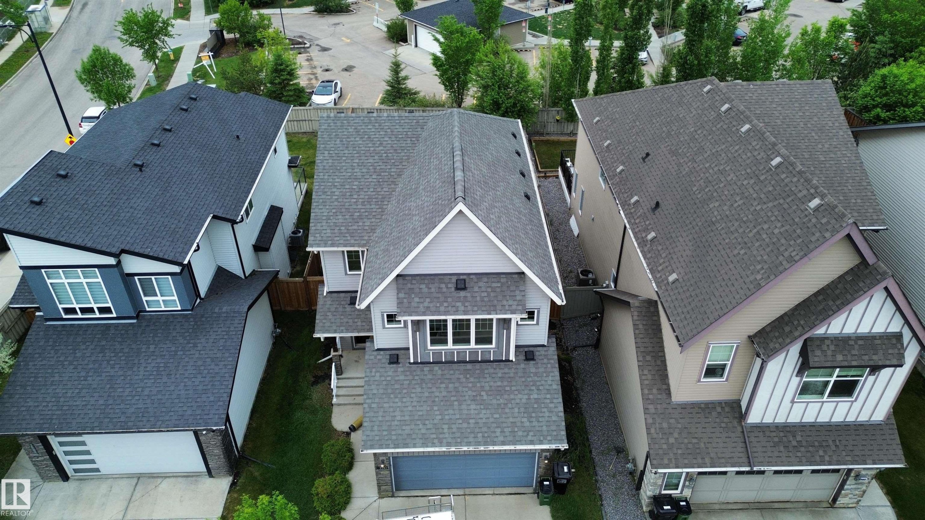 Modern residential architecture featuring a light grey exterior with dark grey trim - 3962 Claxton Loop, Edmonton, AB - Outdoor