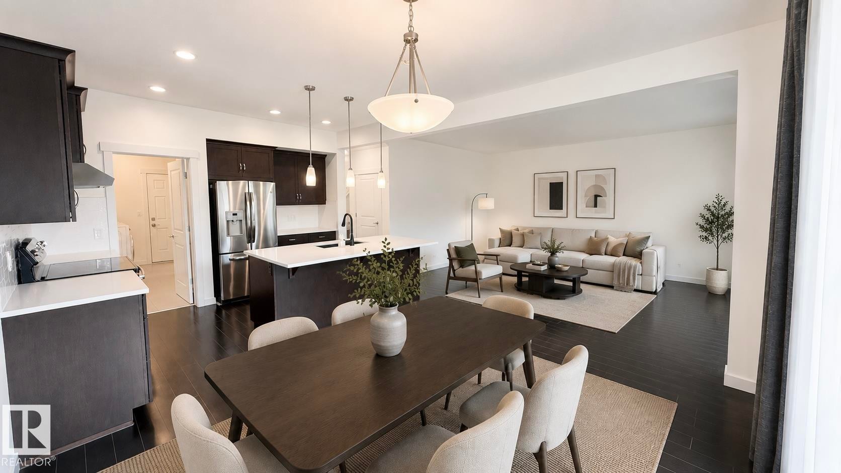 Open-concept living space featuring dark wood-finish flooring throughout - 3962 Claxton Loop, Edmonton, AB - Indoor Photo Showing Dining Room