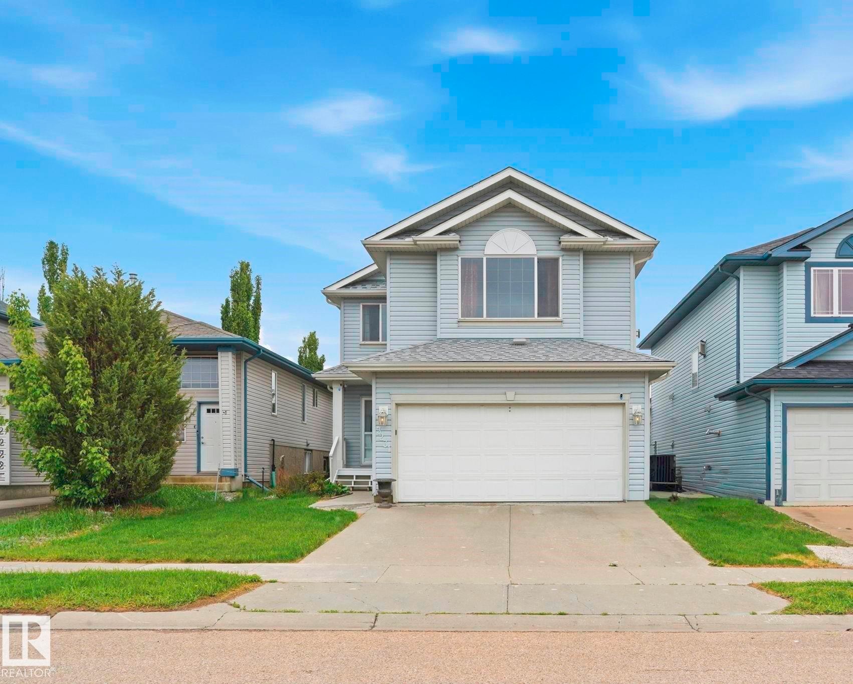 Two-story residential property featuring light blue siding and a light gray shingled roof - 3231 28A Avenue Nw, Edmonton, AB - Outdoor With Facade