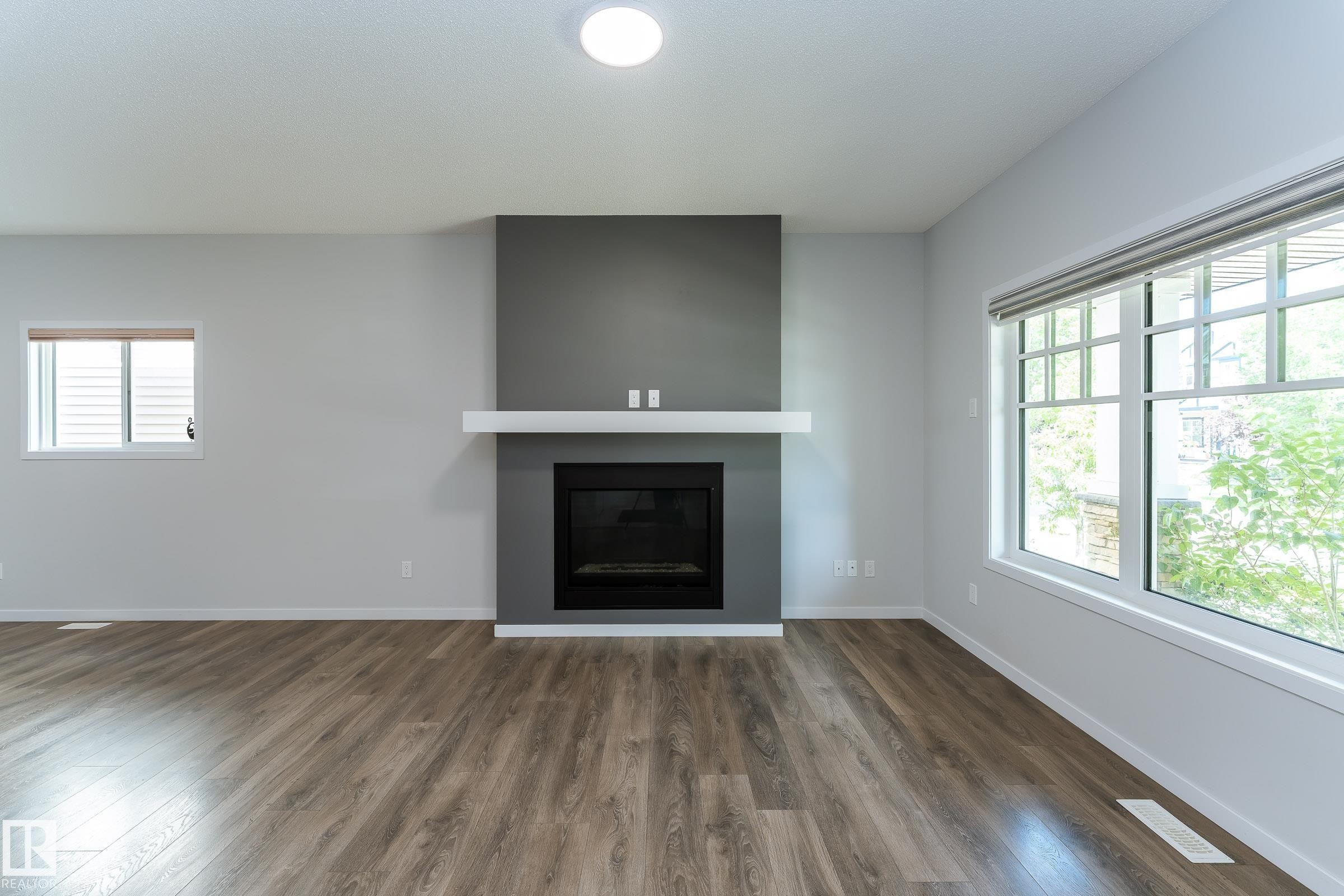 4022 Allan Crescent Sw, Edmonton, AB - Indoor Photo Showing Living Room With Fireplace