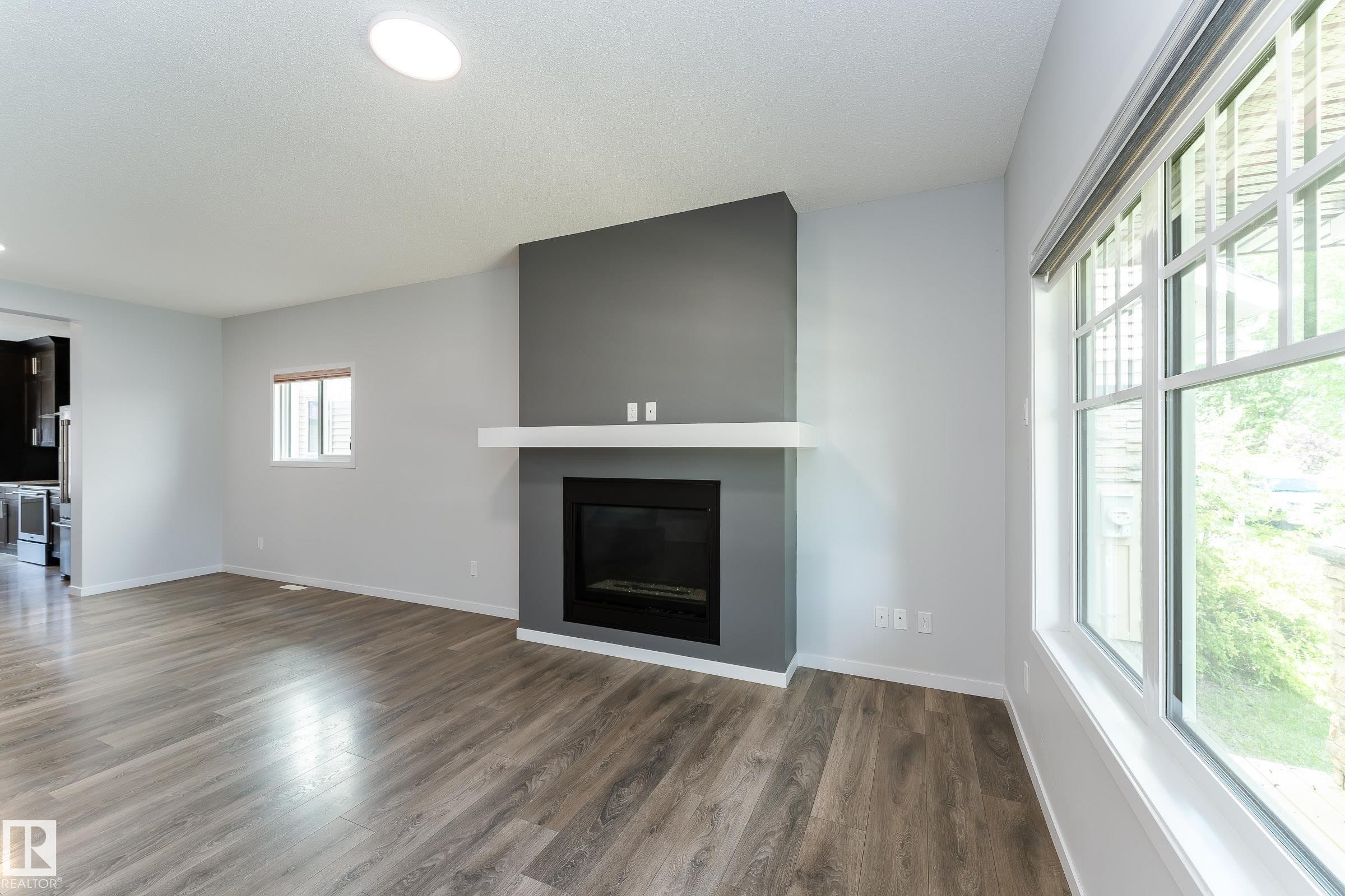 4022 Allan Crescent Sw, Edmonton, AB - Indoor Photo Showing Living Room With Fireplace
