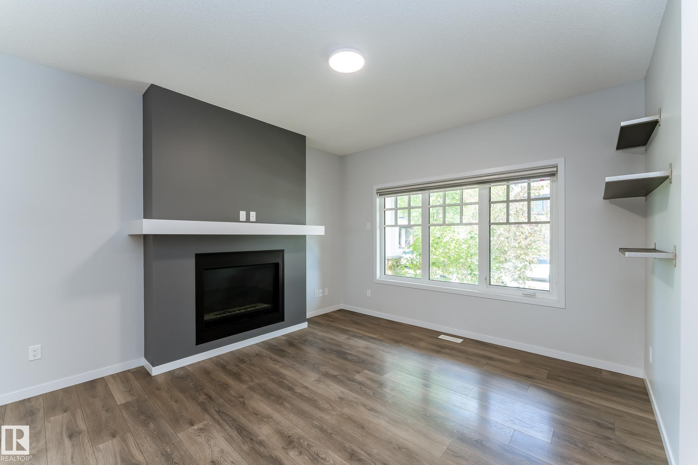 4022 Allan Crescent Sw, Edmonton, AB - Indoor Photo Showing Living Room With Fireplace