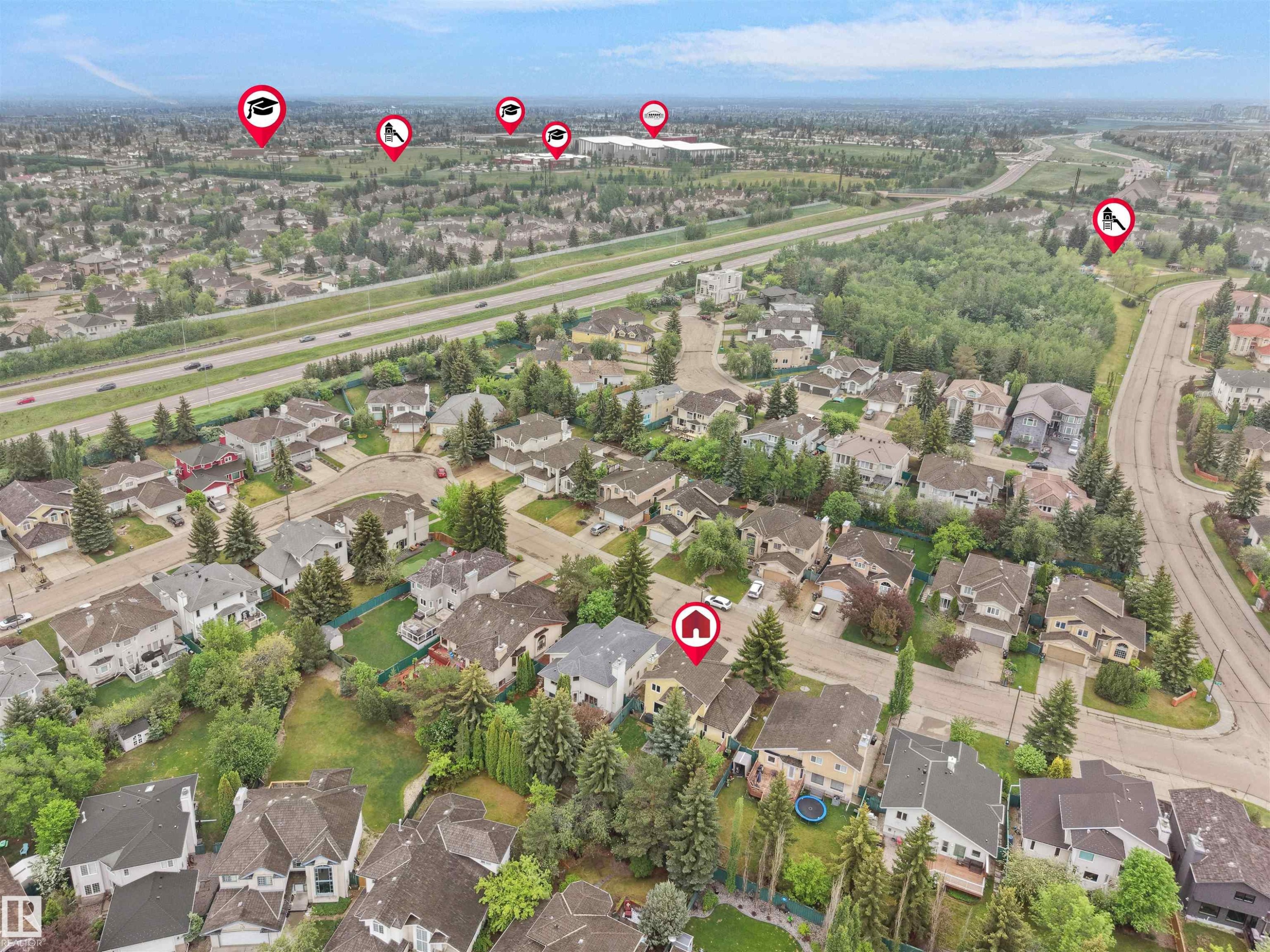 Aerial view showcasing a residential neighborhood with varied architectural styles and abundant mature trees - 208 Ferguson Place, Edmonton, AB