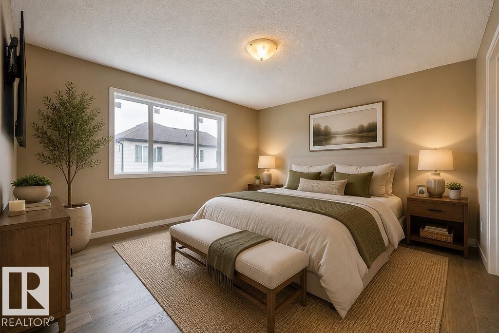 Bedroom featuring wood-finish flooring, a contemporary window, and a ceiling-mounted light fixture. Virtually Staged Photos - 2031 207 Street, Edmonton, AB