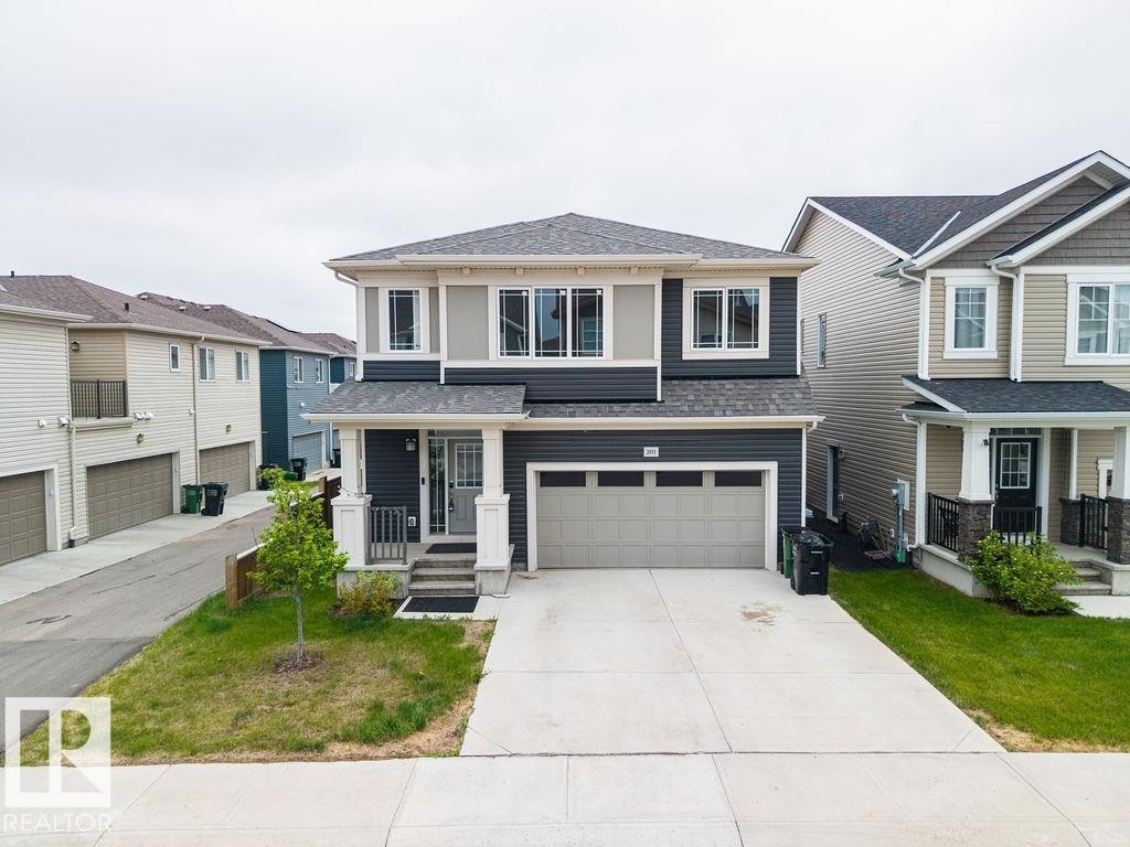 Contemporary two-story residence featuring a dark gray and light gray facade with white trim - 2031 207 Street, Edmonton, AB