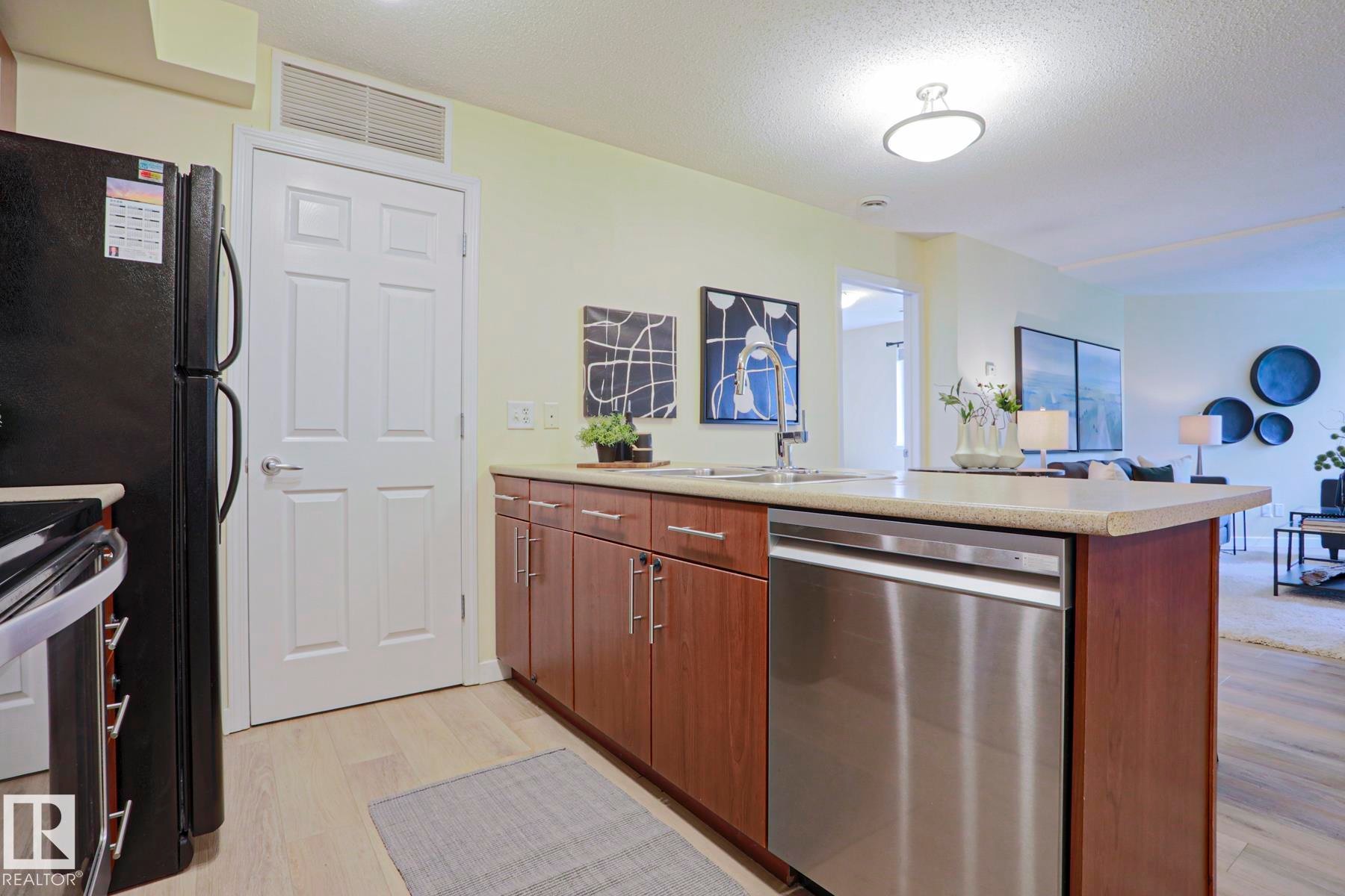 #211 6925 199 St Nw, Edmonton, AB - Indoor Photo Showing Kitchen With Double Sink