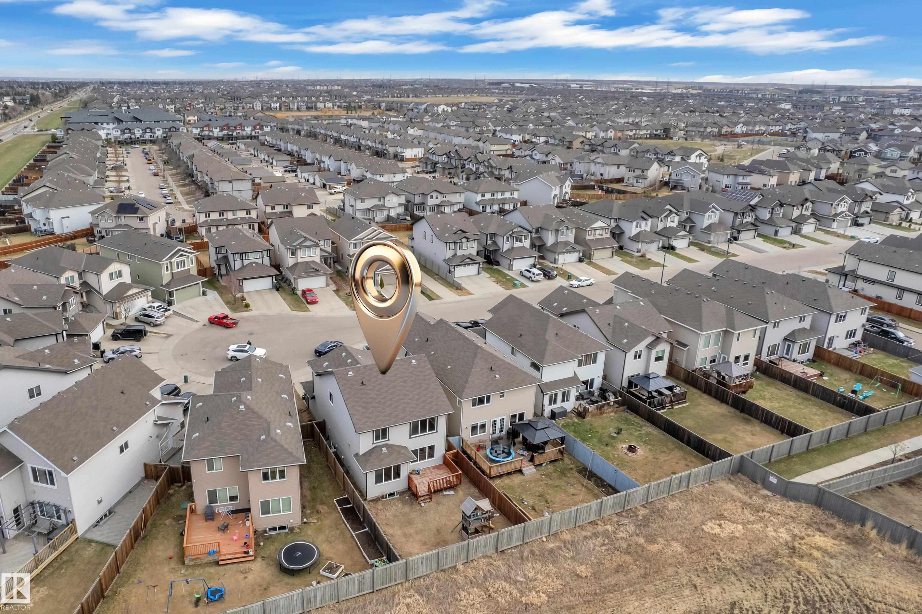 Aerial perspective showcasing a residential development with multiple detached properties - 3363 13 Ave, Edmonton, AB
