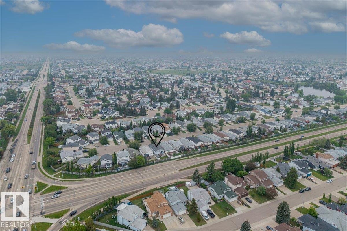 Aerial perspective showcasing a broad residential area with varied housing styles - 8103 154 Avenue, Edmonton, AB