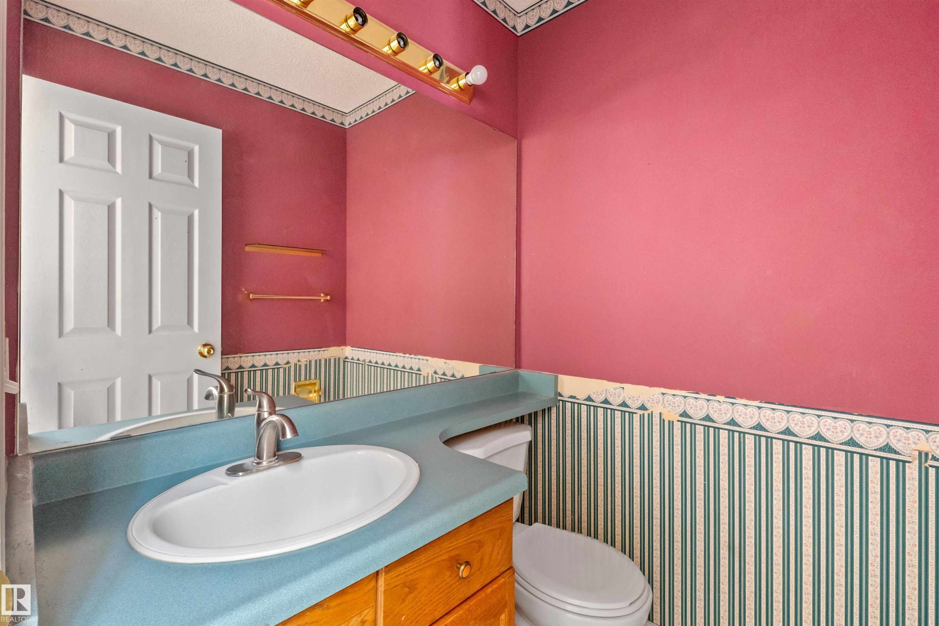 Bathroom featuring a vanity with an integrated oval sink and a blue countertop, complete with a chrome-finish faucet - 5 20 Deerbourne Drive, St. Albert, AB