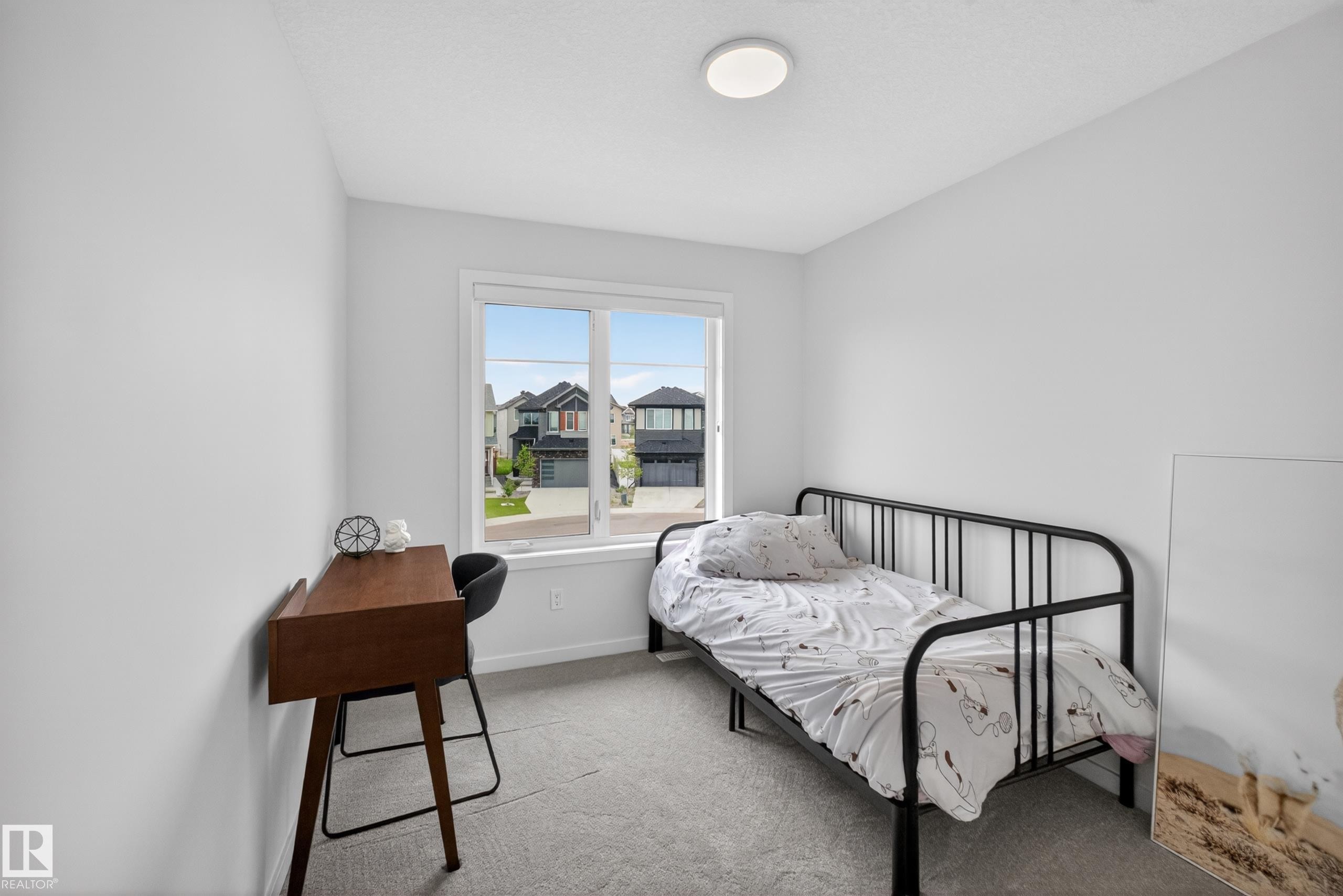 Room featuring light gray carpet flooring, white painted walls, and a recessed ceiling light fixture - 17023 45 Street, Edmonton, AB