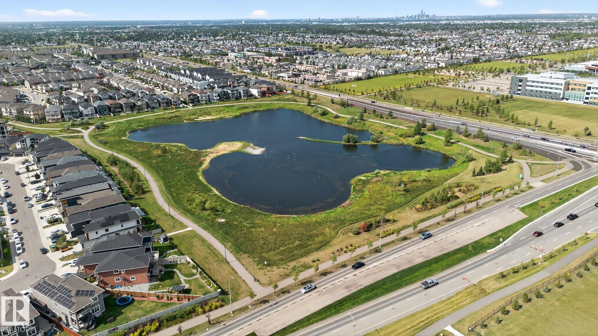 Aerial view showcasing a residential area with a prominent natural water feature - 1213 16A Street, Edmonton, AB