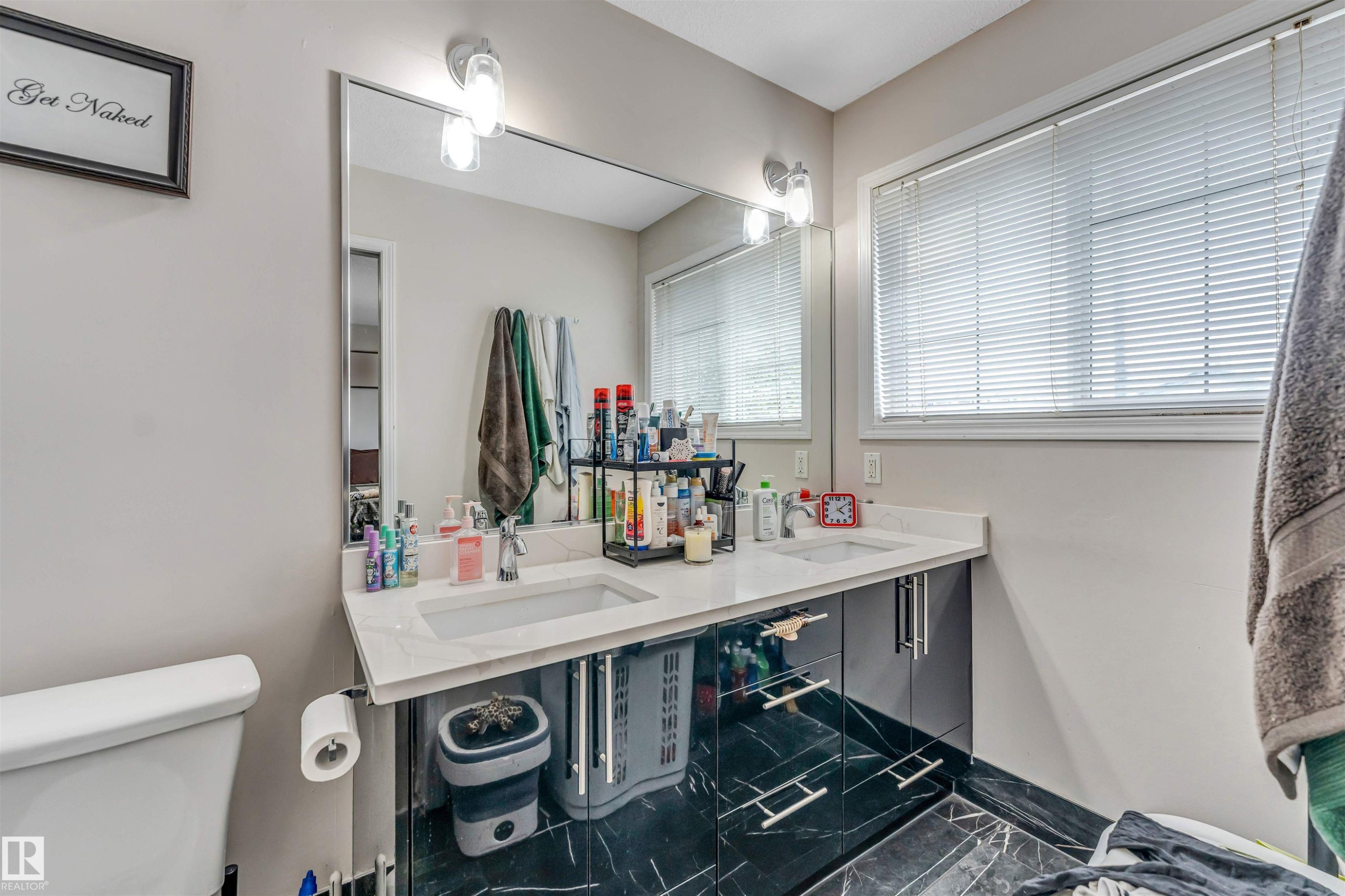 Dual vanity with undermount sinks and white countertops - 3519 22 Street Nw, Edmonton, AB
