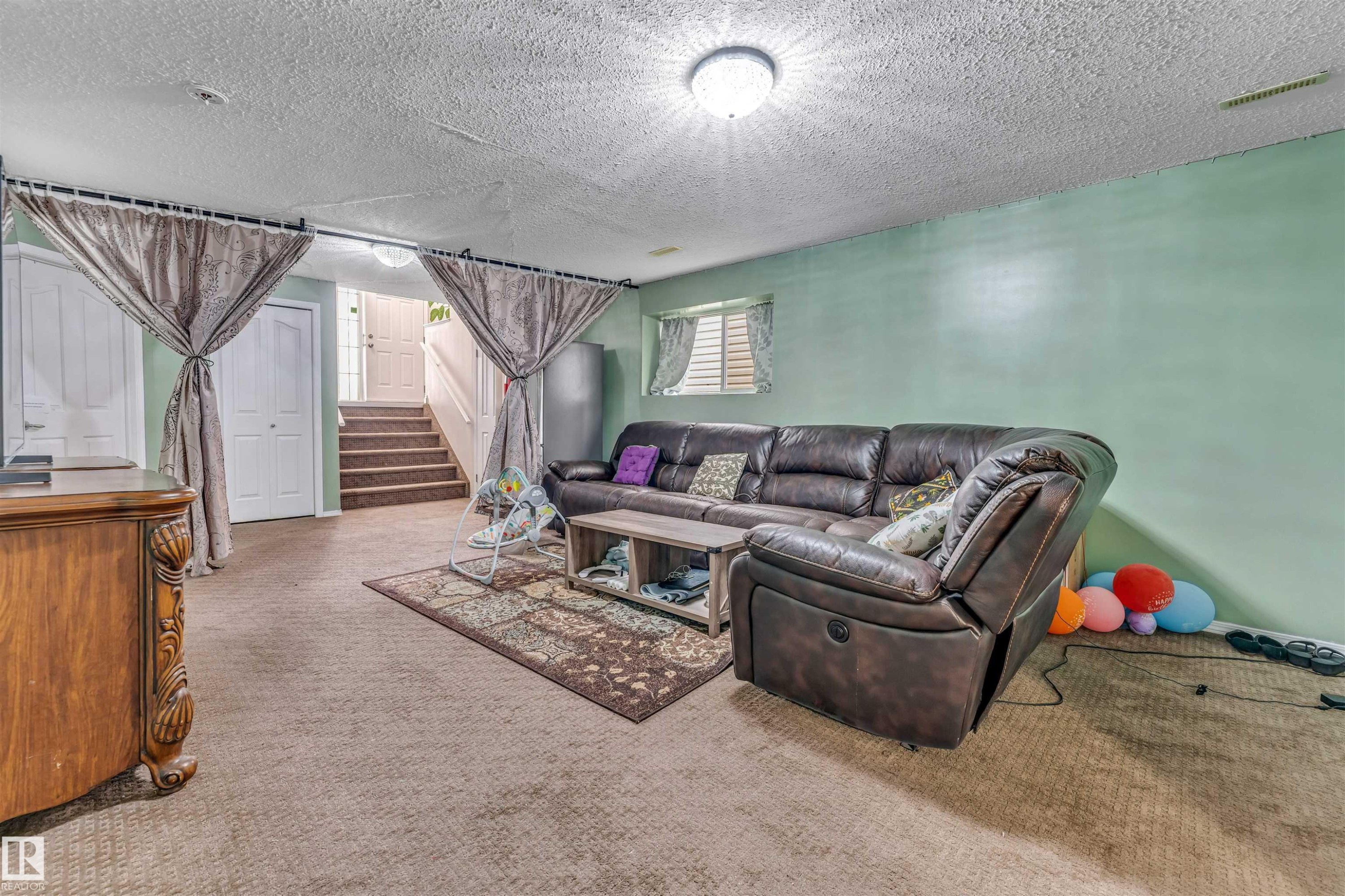 Lower level featuring carpeted flooring and light green walls - 3519 22 Street Nw, Edmonton, AB