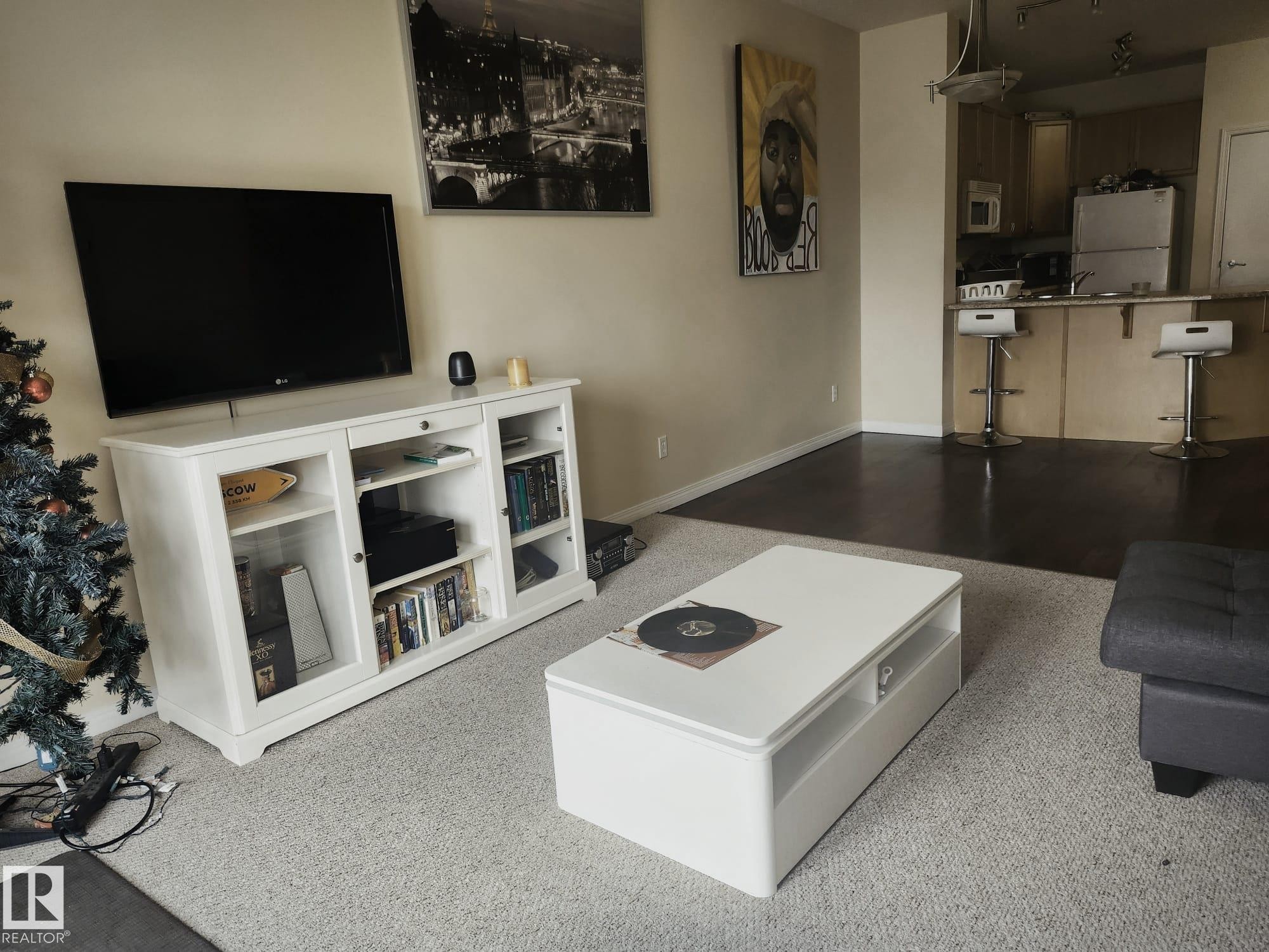 Open-concept living area with light-toned wall paint and recessed lighting - 425 4304 139 Avenue, Edmonton, AB