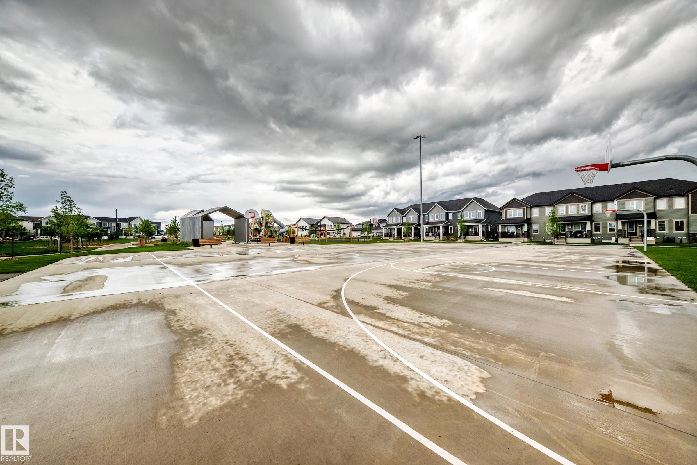 Outdoor basketball court featuring a red hoop and backboard - 1210 Stoneside Road, Sherwood Park, AB - Outdoor