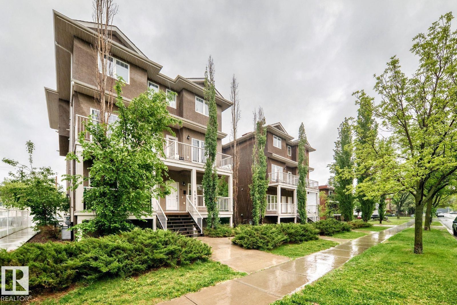 Contemporary townhome-style exterior with dark siding and white trim - 4 11917 103 Street, Edmonton, AB