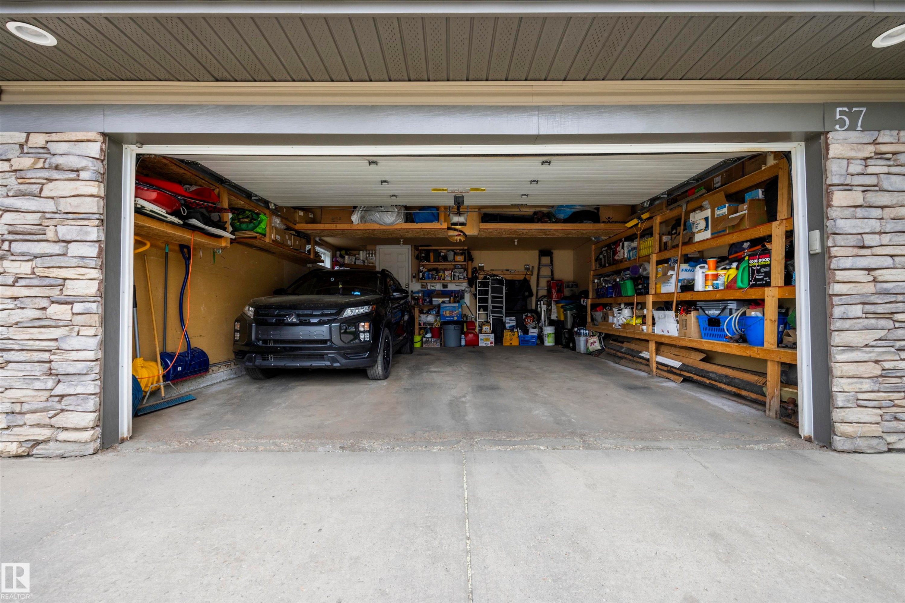 Double car attached garage (20FT Wide x 23FT Long) - 57 Homestead Crescent Nw, Edmonton, AB - Indoor Photo Showing Garage