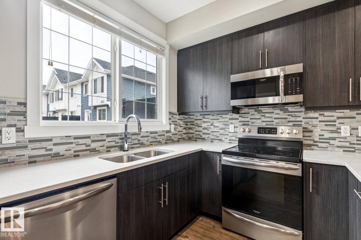 739 Allard Boulevard Sw, Edmonton, AB - Indoor Photo Showing Kitchen With Double Sink With Upgraded Kitchen