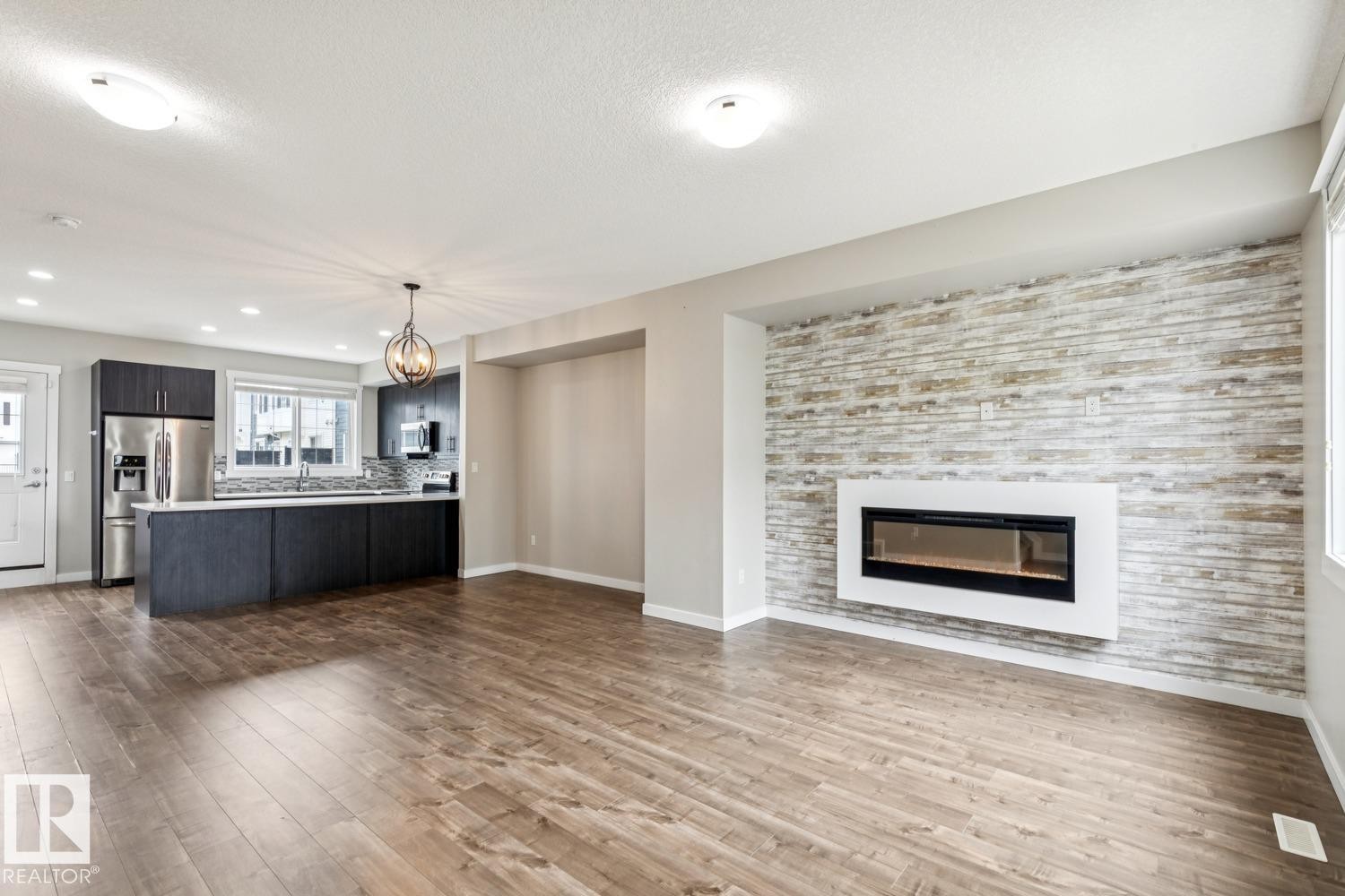 739 Allard Boulevard Sw, Edmonton, AB - Indoor Photo Showing Living Room With Fireplace