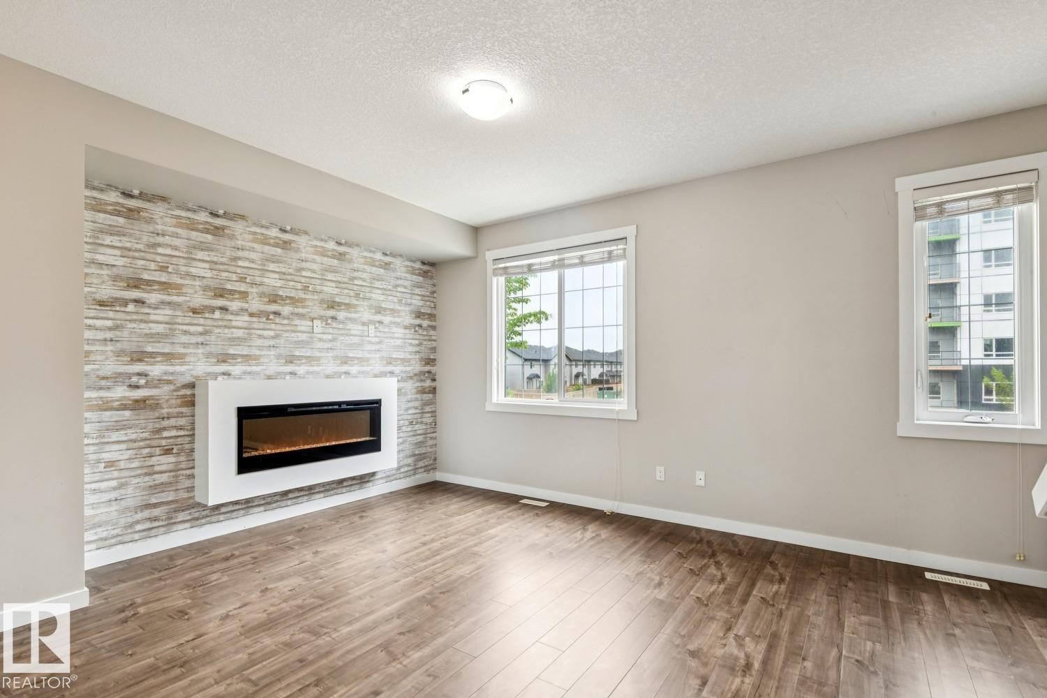 739 Allard Boulevard Sw, Edmonton, AB - Indoor Photo Showing Living Room With Fireplace