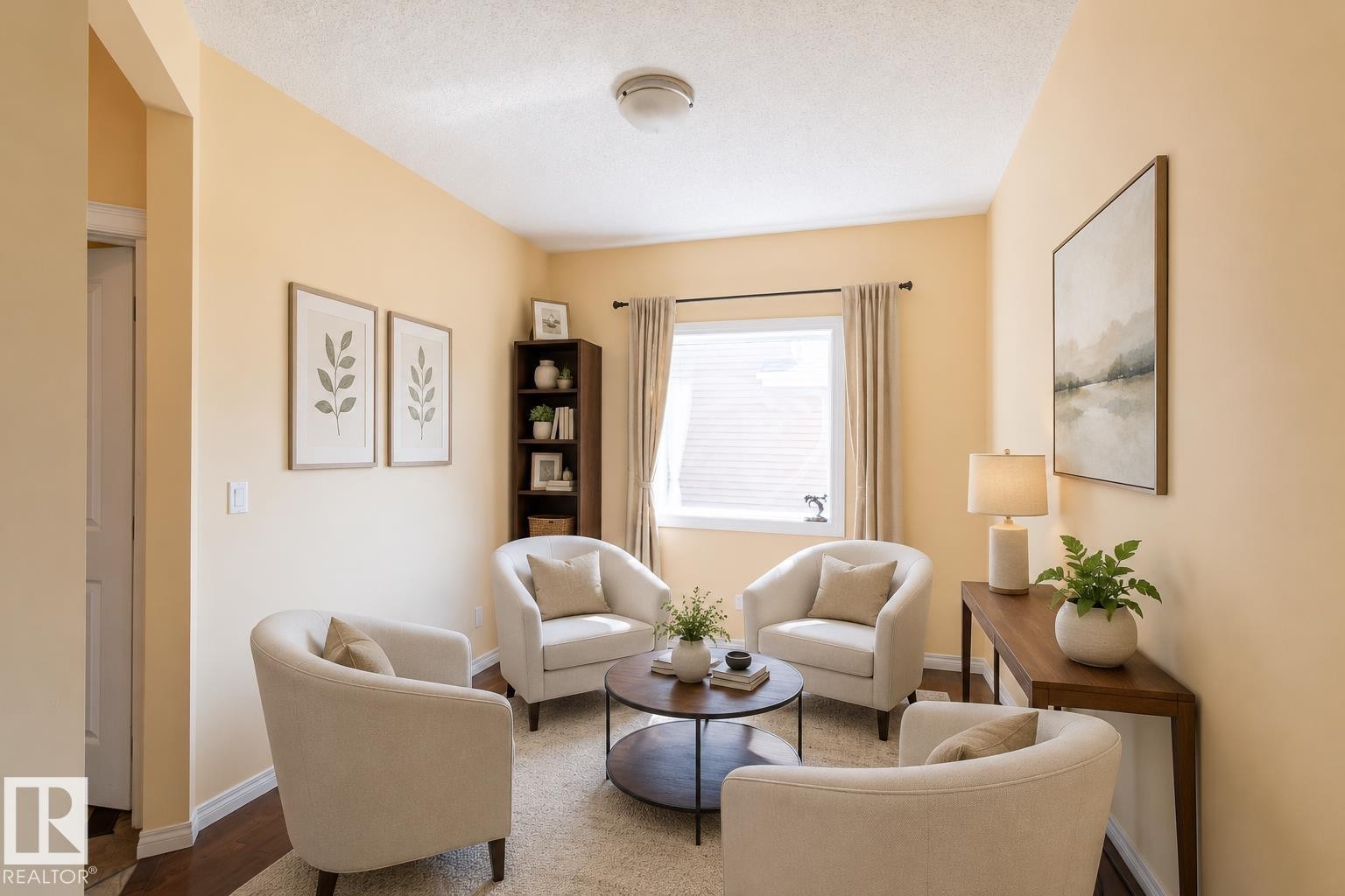 Bright interior space featuring light-toned walls, wood-finish flooring, and a window with blinds and drapes - 1840 56 Street, Edmonton, AB