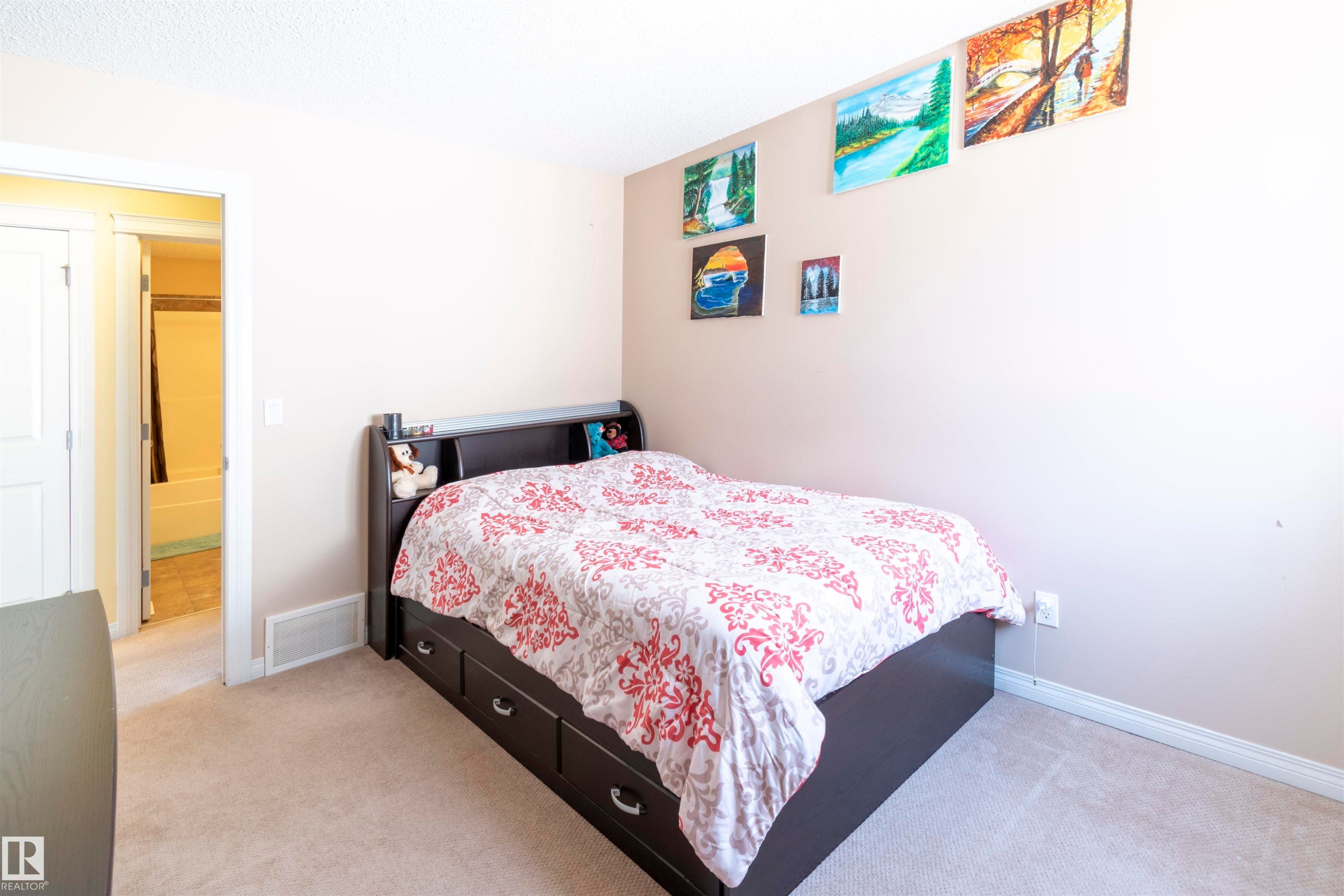 Carpeted room with light neutral walls and baseboards - 1840 56 Street, Edmonton, AB