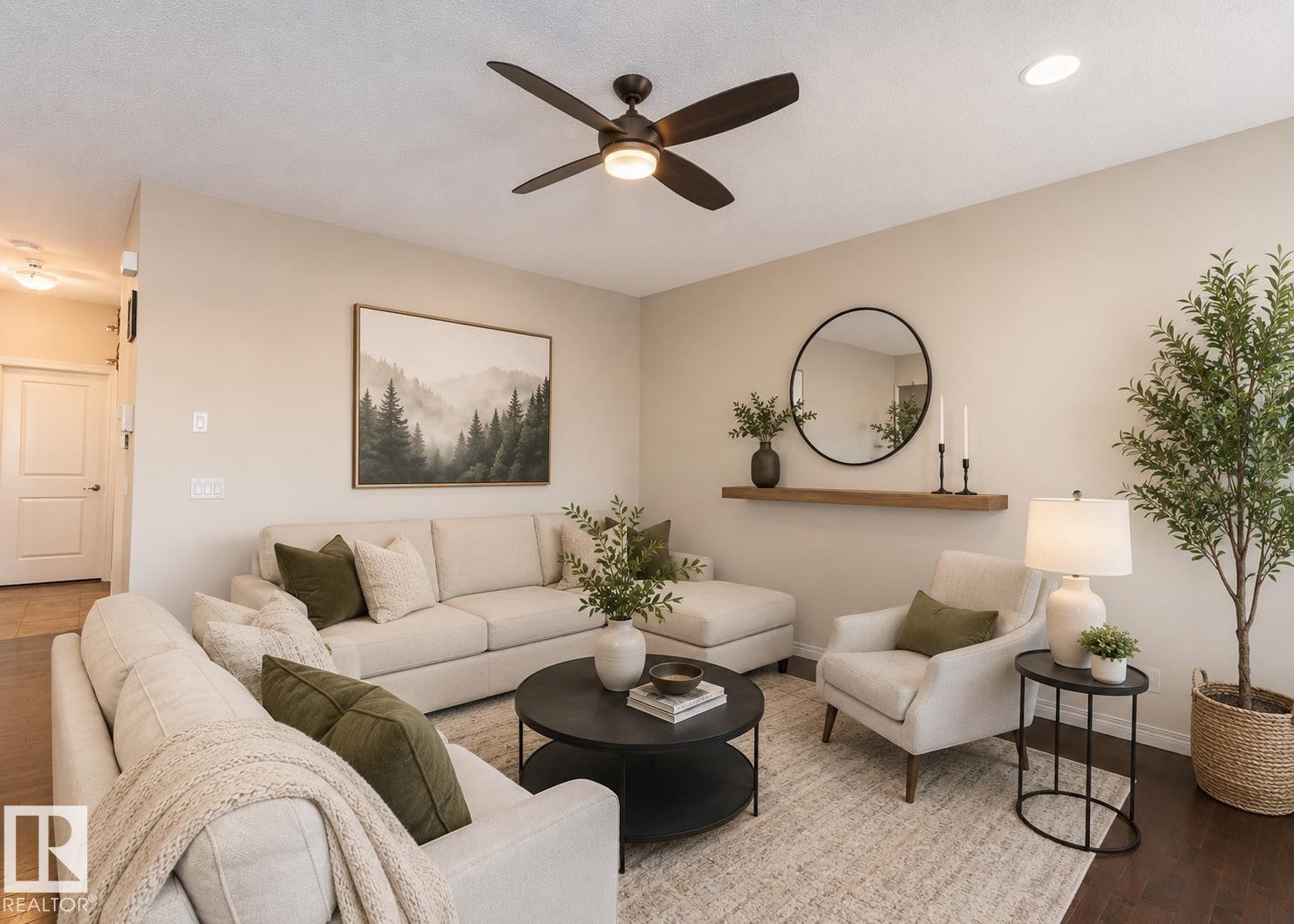 Spacious living area featuring neutral wall tones, recessed lighting, wood-finish flooring, a ceiling fan, and a wood floating shelf - 1840 56 Street, Edmonton, AB