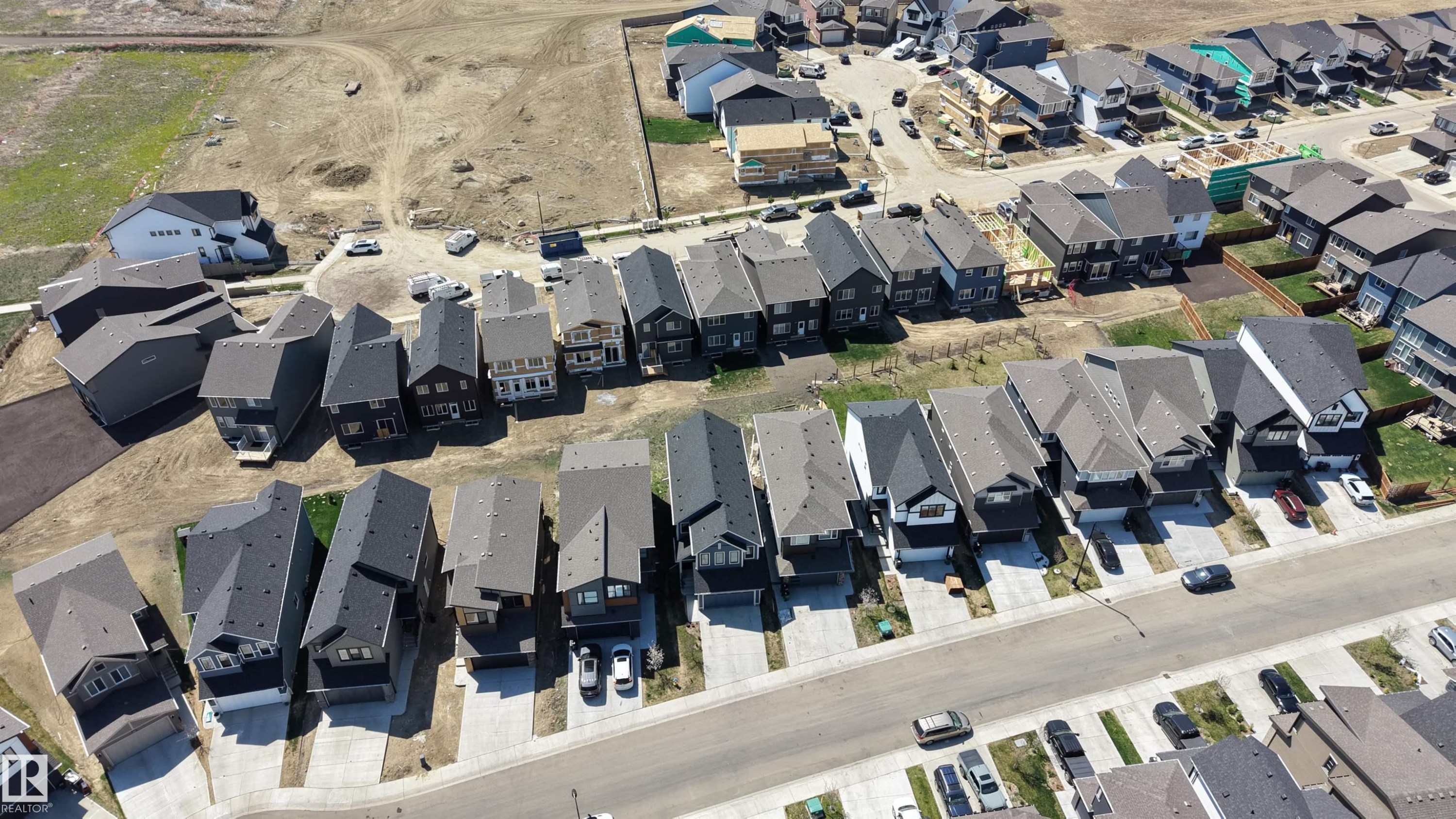 Aerial perspective showcasing a residential development with numerous single-family homes - 2120 Muckleplum Crescent, Edmonton, AB