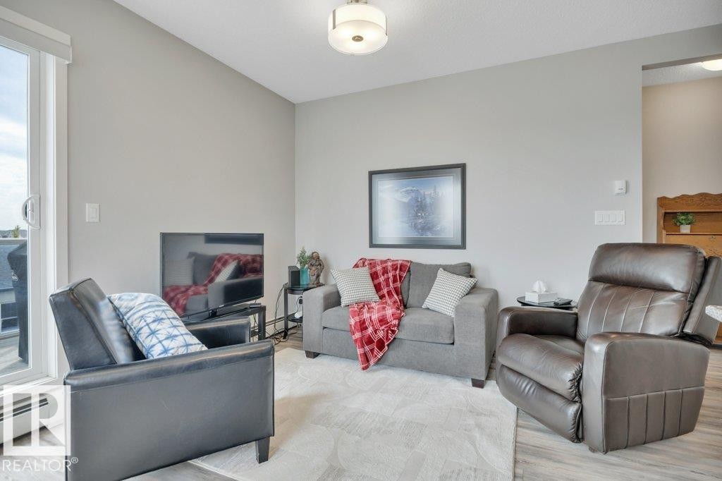 402 812 Welsh Drive Sw, Edmonton, AB - Indoor Photo Showing Living Room