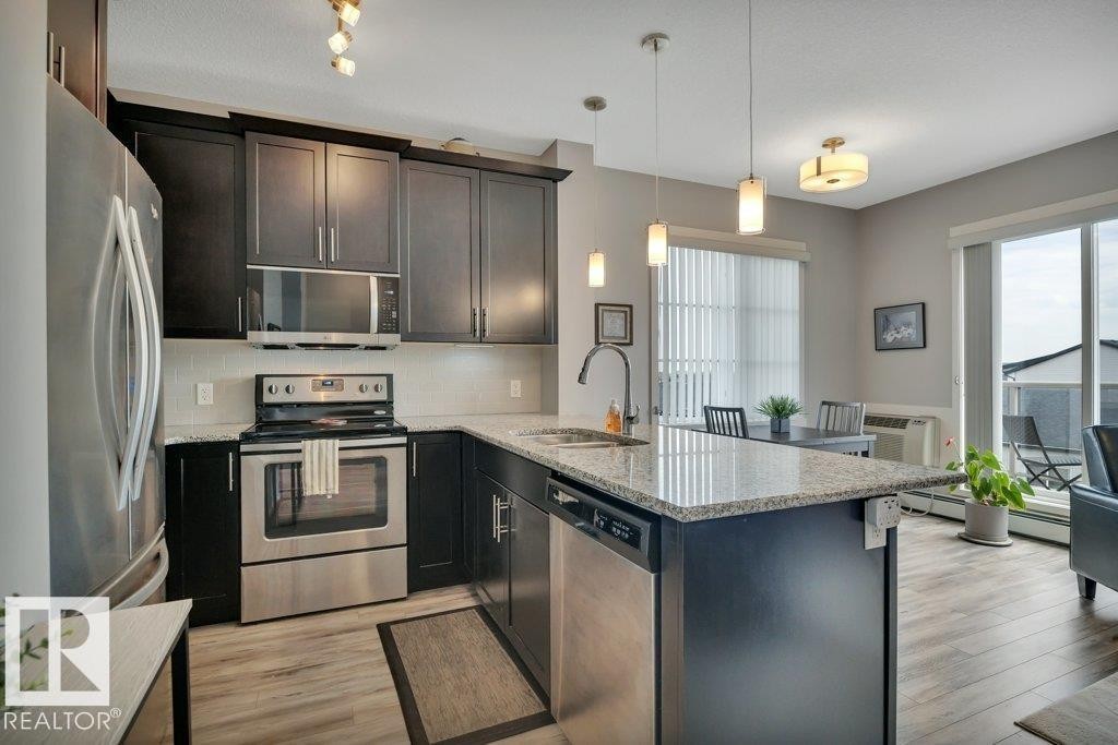 402 812 Welsh Drive Sw, Edmonton, AB - Indoor Photo Showing Kitchen With Upgraded Kitchen