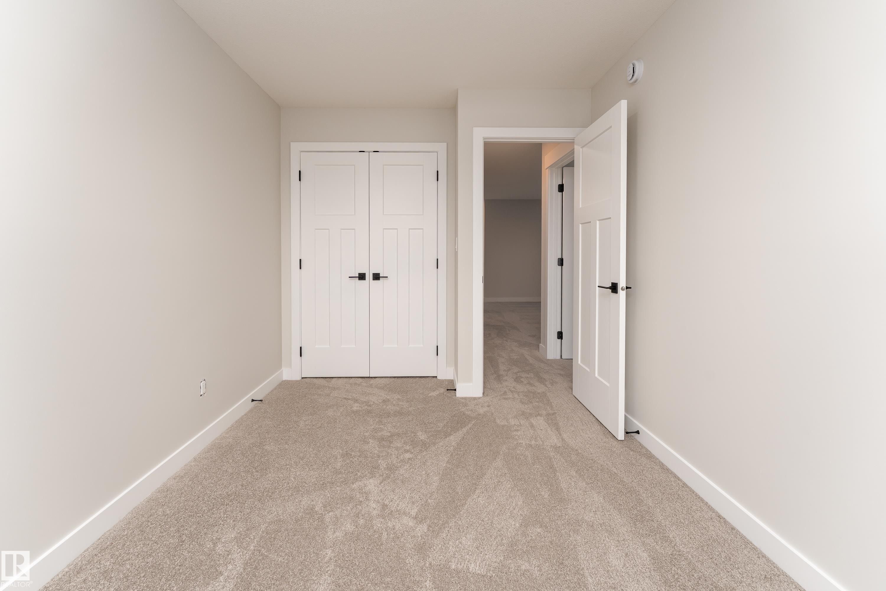 Neutral-toned carpeting throughout - 115 Garneau Gate, Spruce Grove, AB