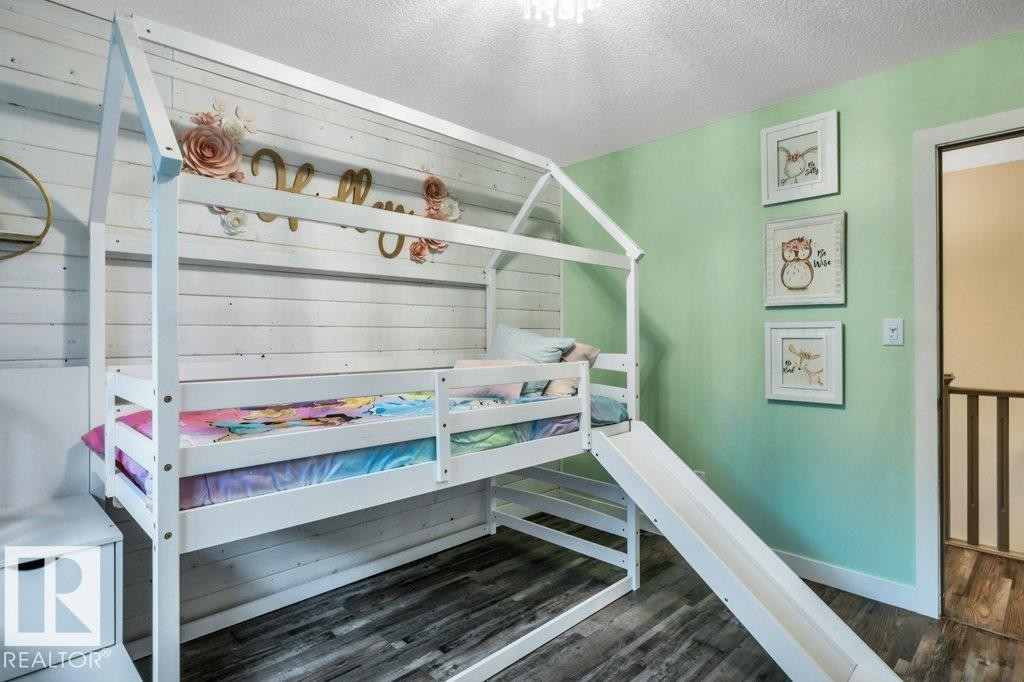 Light green accent wall with framed artwork - 1107 Chahley Crest, Edmonton, AB